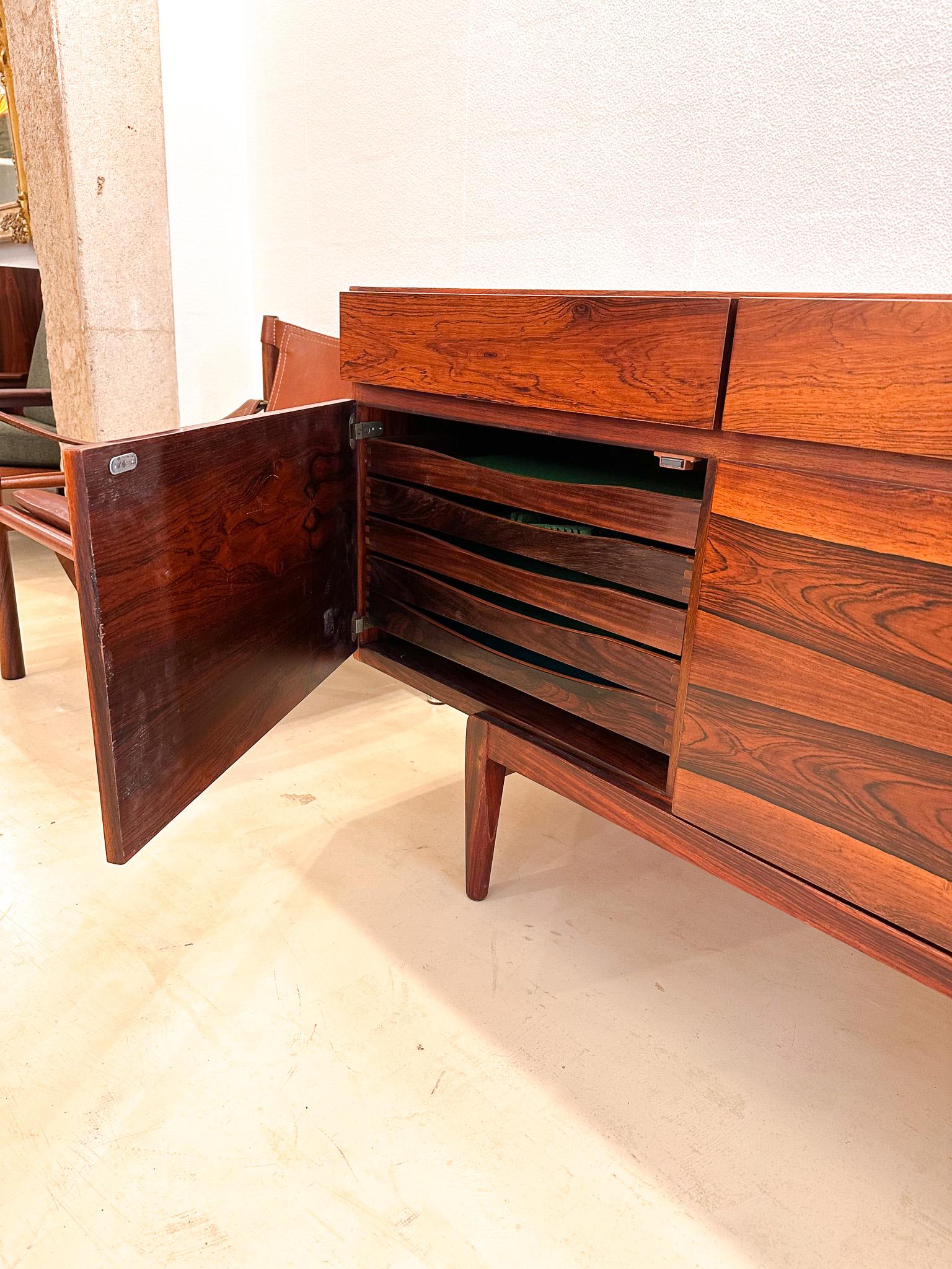 Designed by Ib Kofod-Larsen and manufactured in Denmark in the 1960s, this clean-lined sideboard features beautifully rosewood. The case sits on a raised base and offers four drawers above a four-door cabinet.
One of the most iconic and desired