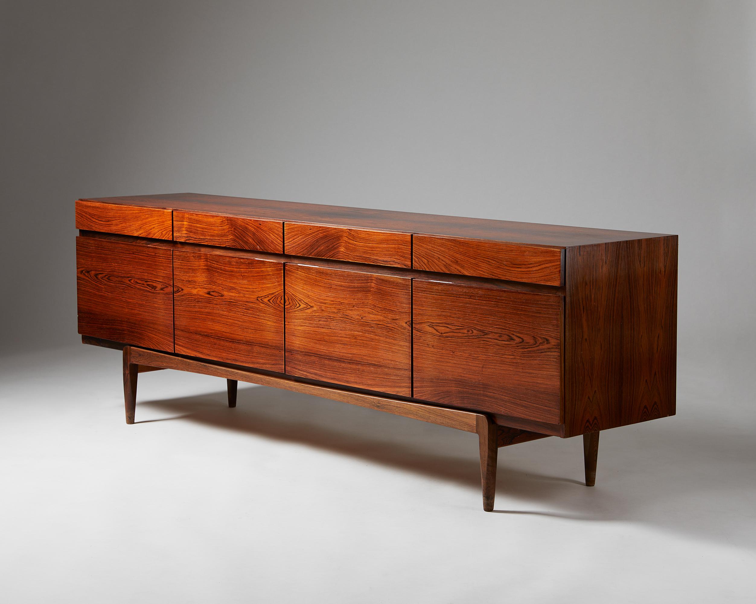 Sideboard model FA 66 designed by Ib Kofod-Larsen for Faarup Möbelfabrik,
Denmark. 1960s.
Rosewood.

Stamped.

The clean lines of Ib Kofod-Larsen’s model FA 66 in rosewood make it a notable Scandinavian mid-century collectable. Remarkably, it