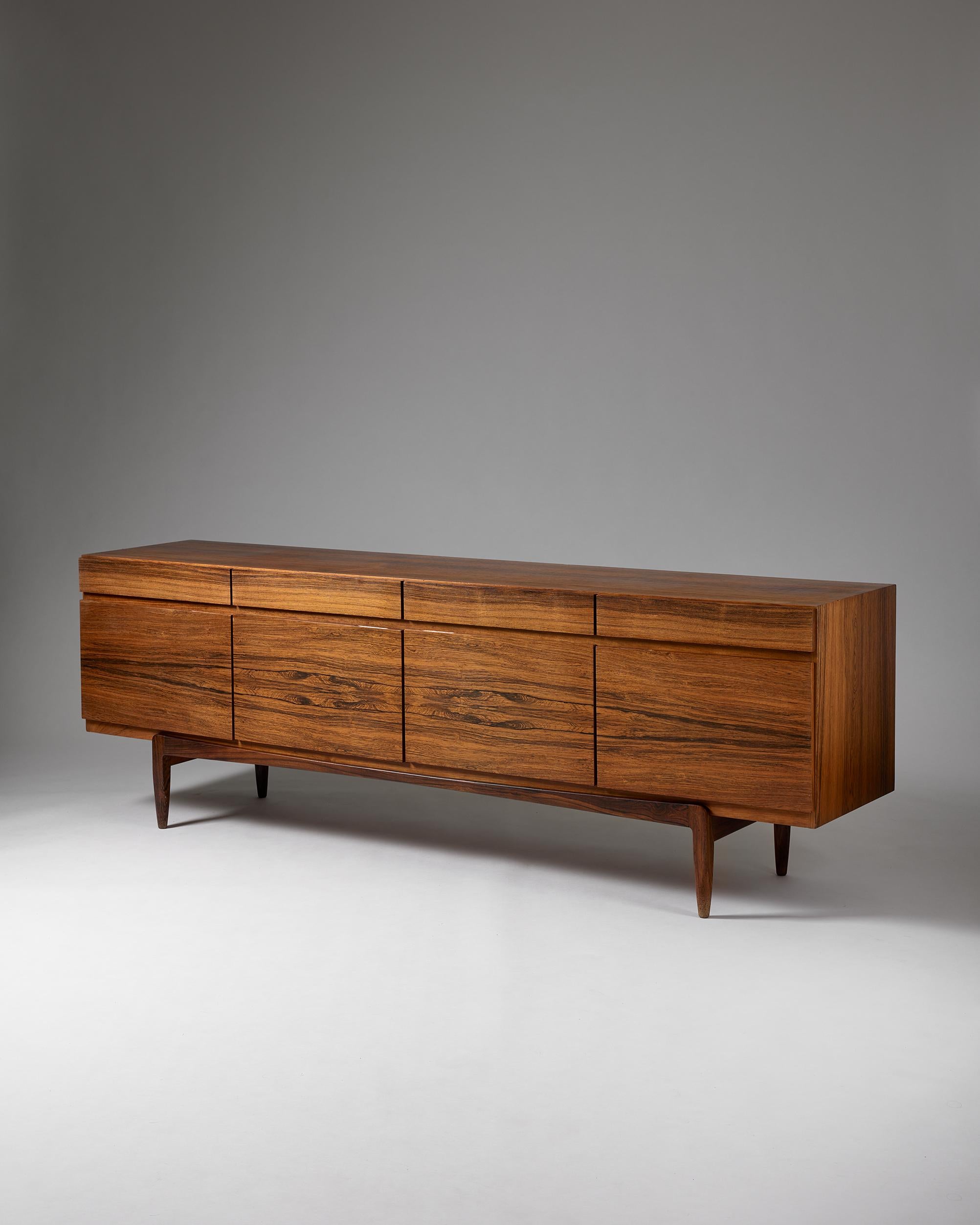 Sideboard model FA 66 designed by Ib Kofod-Larsen for Faarup Möbelfabrik,
Denmark, 1960s.

Rosewood.

The clean lines of Ib Kofod-Larsen’s model FA 66 in rosewood make it a notable Scandinavian mid-century collectable. Remarkably, it appears as if