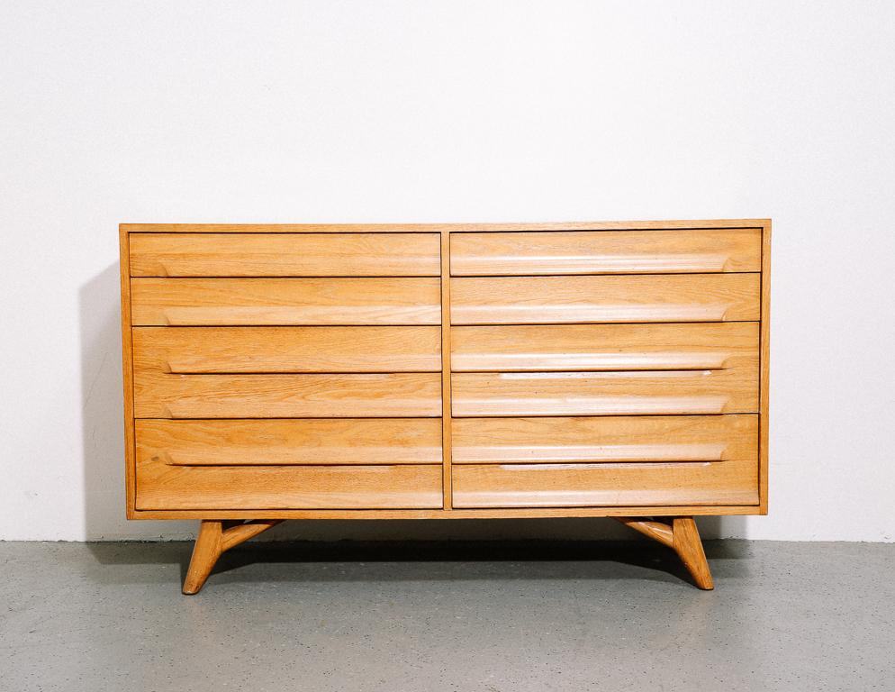 Oak sideboard or dresser designed by Jack Van der Molen for the Americana Casual line by Jamestown Lounge Co. Minimal form with sculpted legs.