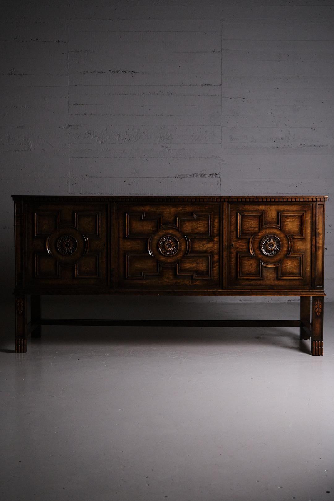 Sideboard attributed to the Swedish designer Axel Einar Hjorth. Produced by Bodafors as part of the series 'Borgholm' during the 1920s. 

Elegant design in stained birch. 