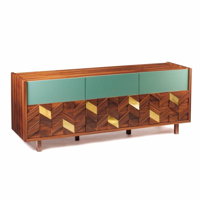 Samoa sideboard is a high quality product by Mambo Unlimited Ideas, crafted in polished or matte iron wood venner structure and feet, brass applications and lacquered doors. It features a three dimensional design on its doors, elegant polished brass