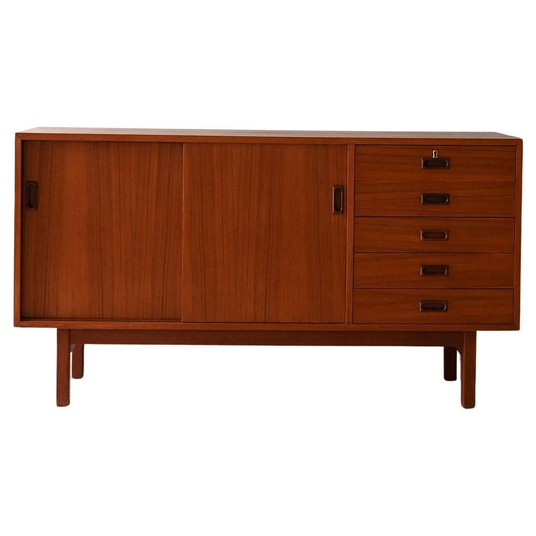 Scandinavian teak sideboard with sliding doors