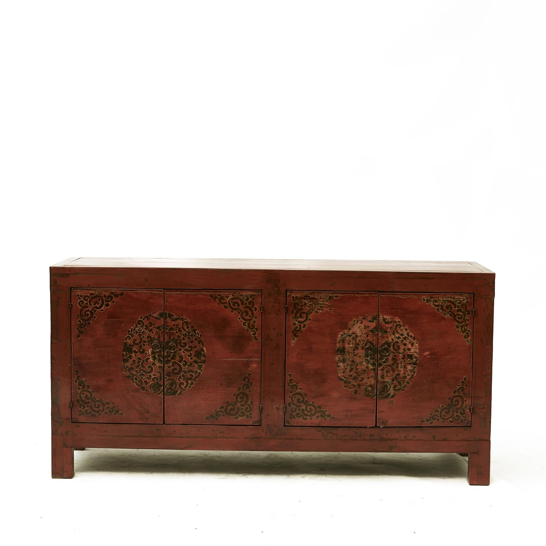 Sideboard with two pairs of doors, original ruby ??red lacquer color and doors decorated in polychrome lacquer colours.
Natural beautiful age-related patina.

Shandong Province 1850 - 1870.
