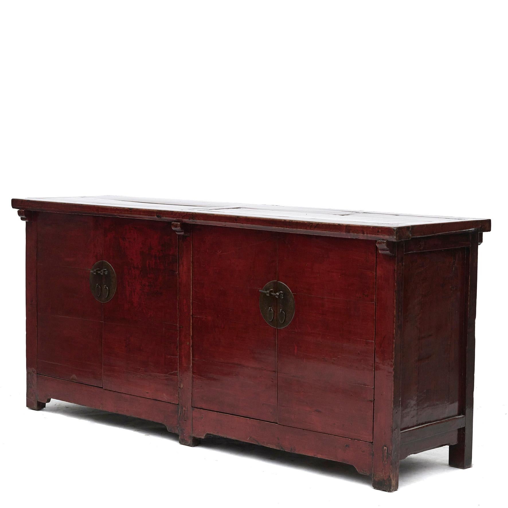 Sideboard with 2 pairs of doors, made of elm wood.
Original red lacquer with natural age-related beautiful patina, highlighted by a clear lacquer surface finish.

Shanxi Province 1850 - 1870.