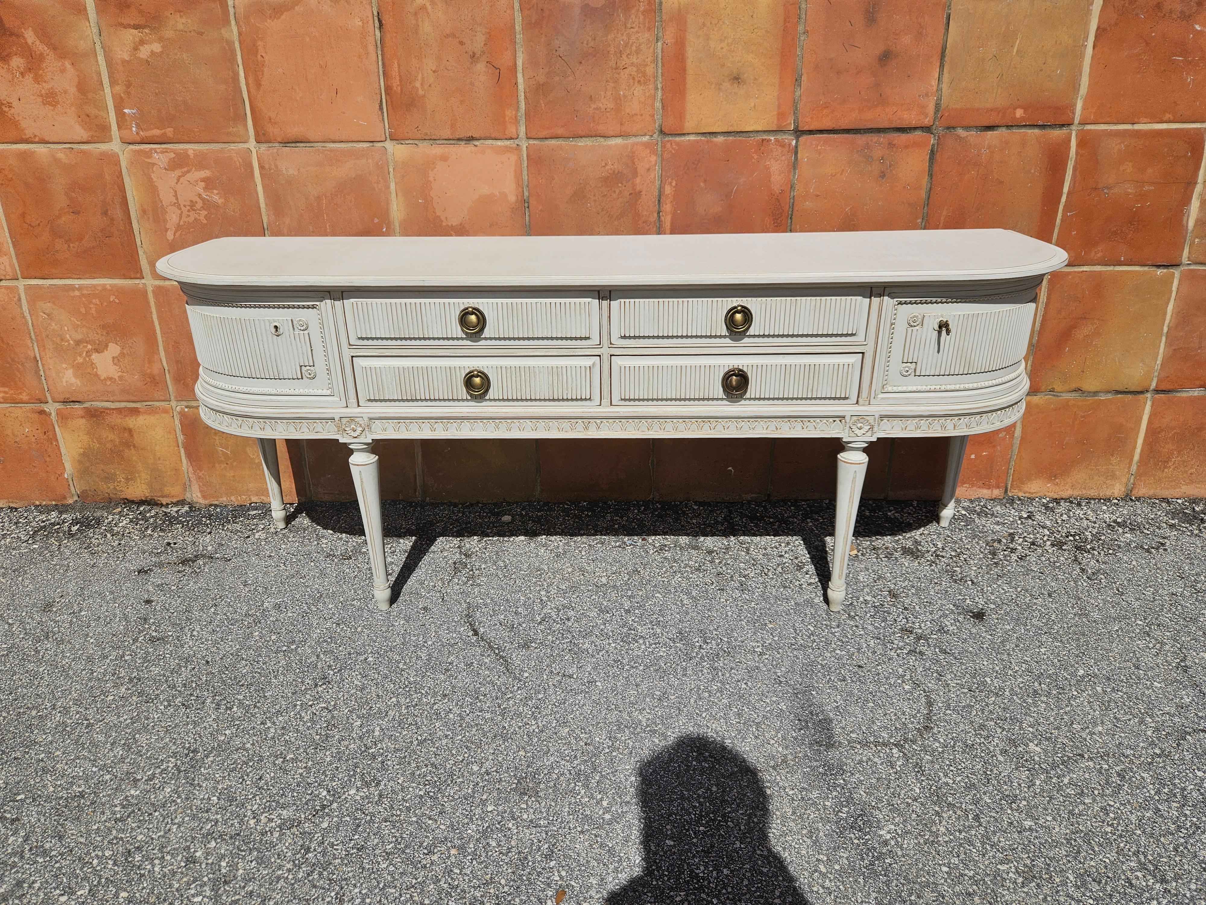 This is a Swedish Gustavian style Sideboard. its been restored and repainted with Milk Paints 