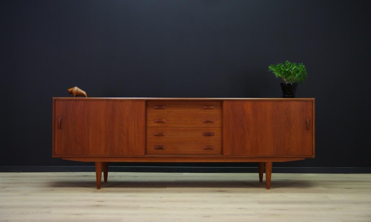 Fantastic sideboard from 1960s-1970s - minimalistic form finished with teak veneer. Roomy interior with shelves behind sliding doors and spacious drawers. Preserved in good condition (visible small dings and scratches, filled veneer loss) - directly