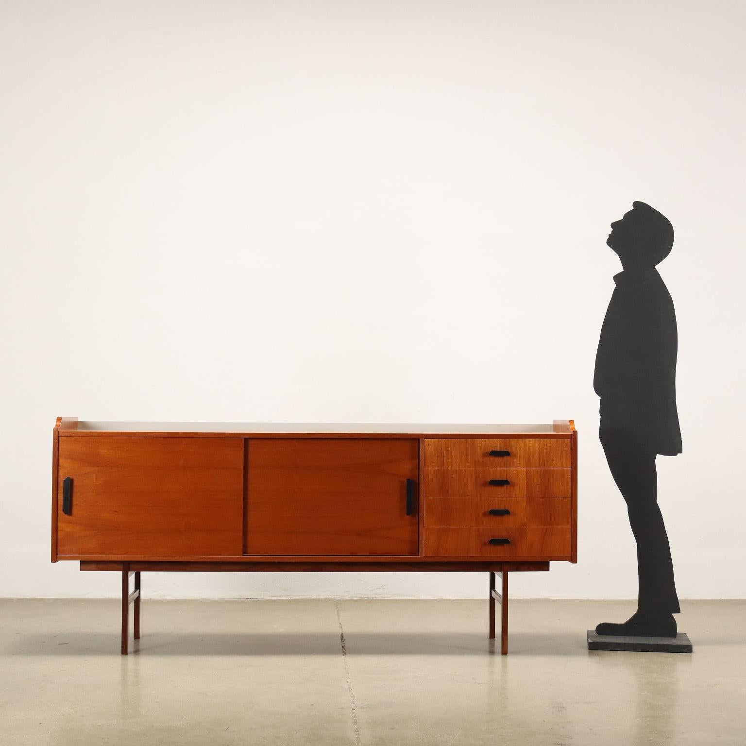 Sideboard with sliding doors and visible drawers; teak veneered wood.