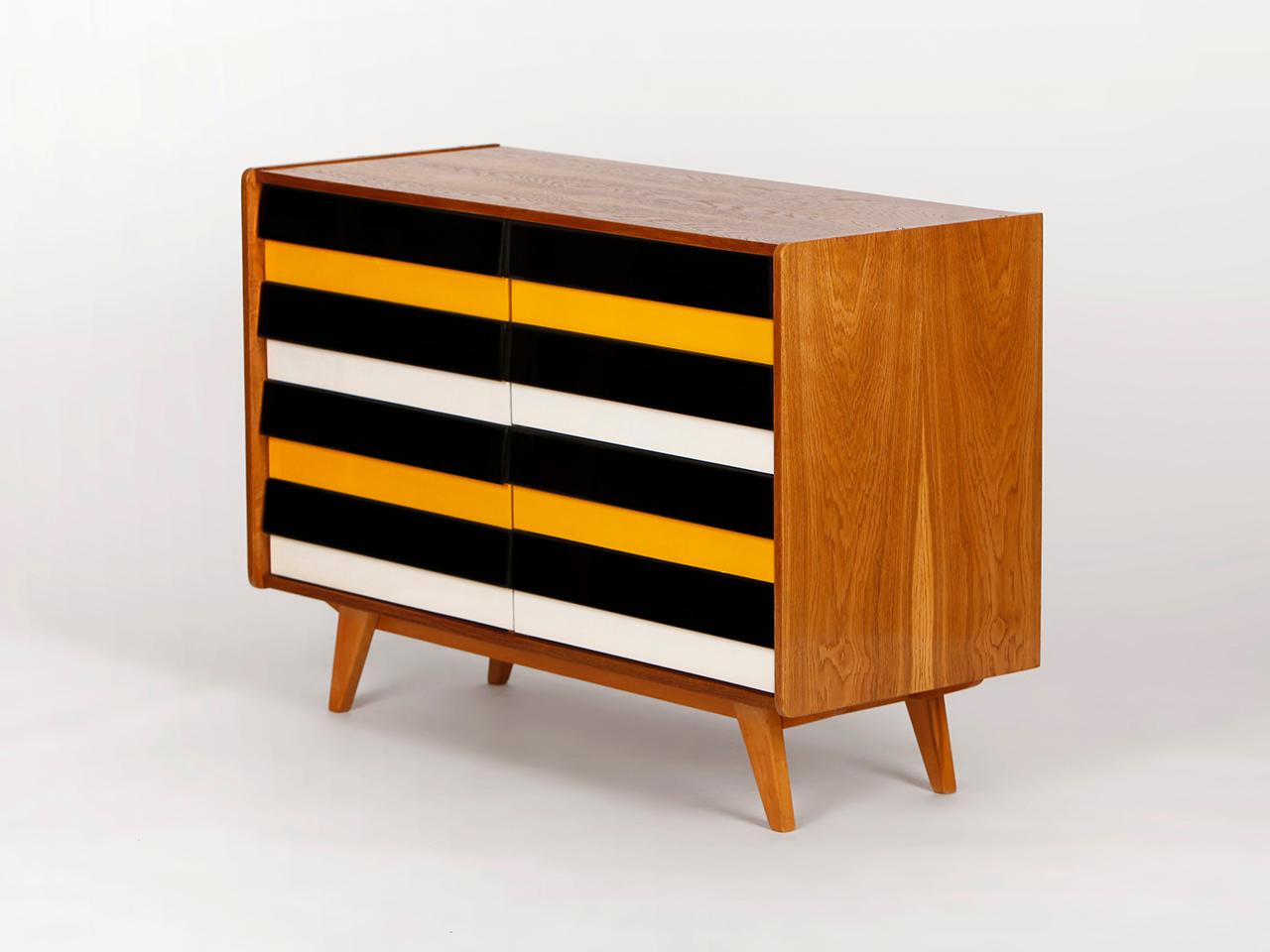 This model U-453 sideboard was designed by Jiri Jiroutek for Interier Praha in former Czechoslovakia. Produced in the 1960s. 
Completely restored. Excellent condition. It is an early model with wooden drawers.