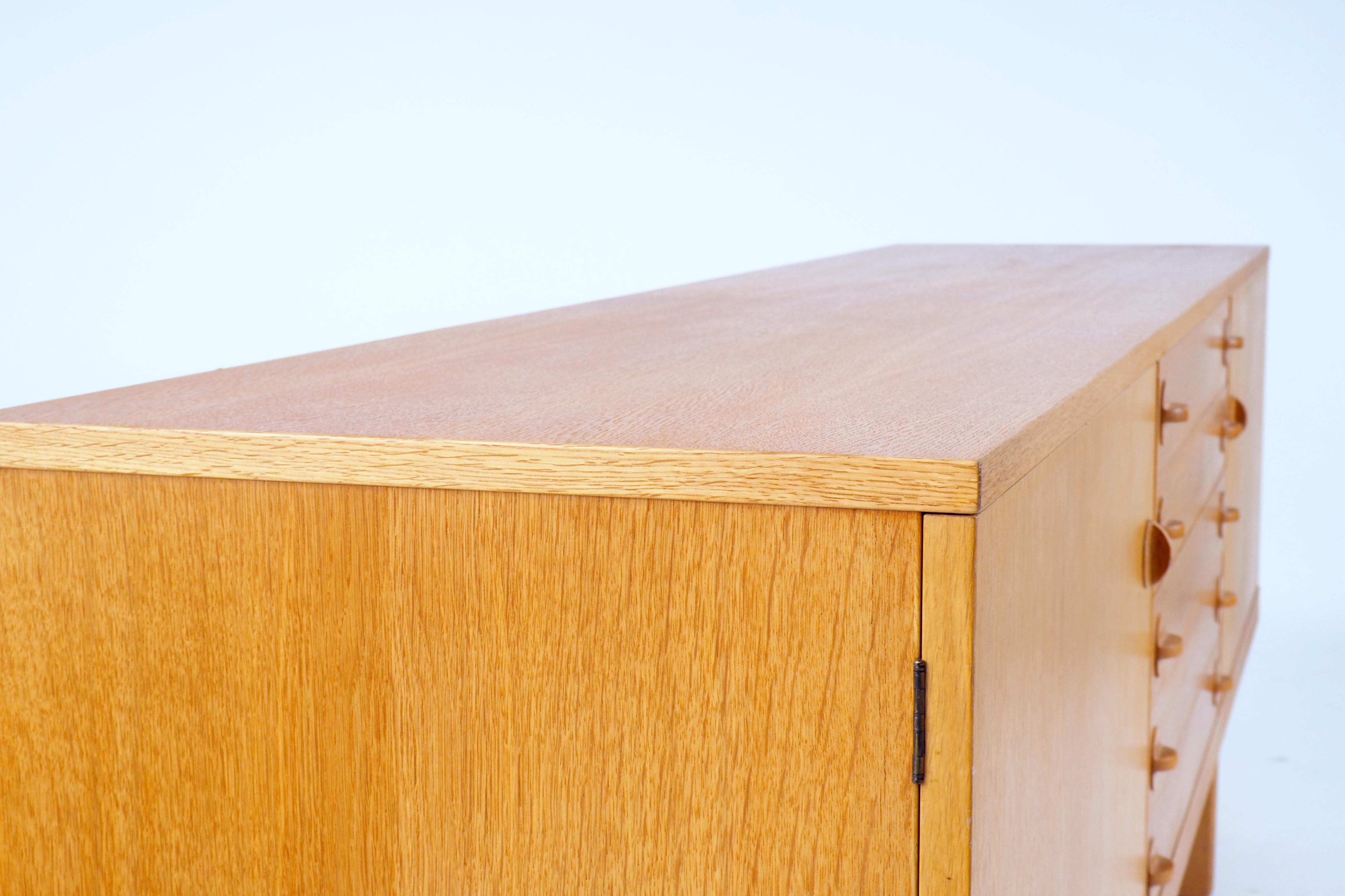 Sideboard in oak by Björn Hultén. Made in Sweden during the 1960s by Bofyra.
Hultén was the interior architect for more than 40 Swedish embassies all-over the world, for instance in Moscow and Washington.