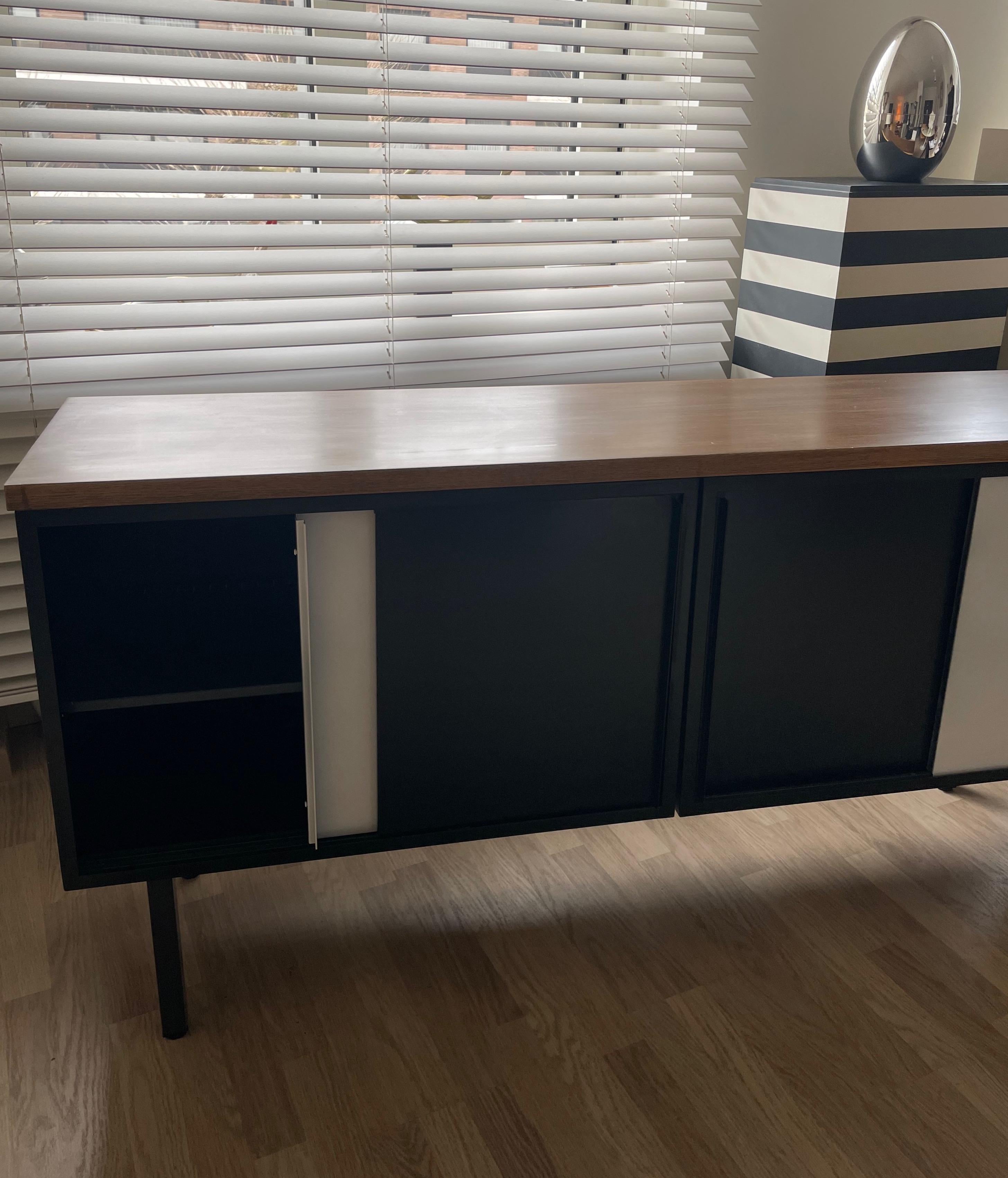 Four black and white sliding doors and two shelves sideboard with a thick wood top.
Designed by Cees Brackman, Netherlands.
circa 1950.