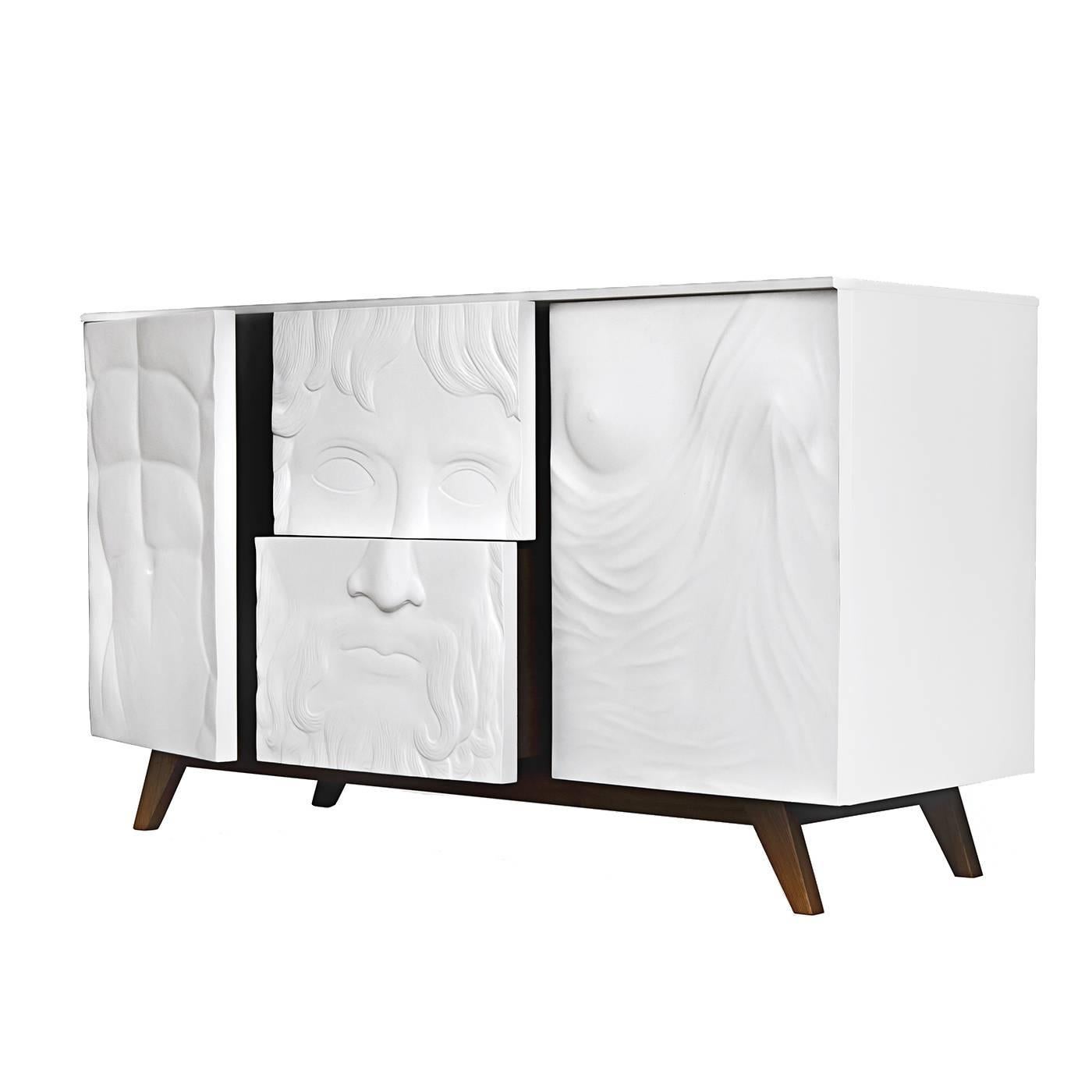 A celebration of classical art, this sideboard reinterprets the iconic ancient Greek and Roman sculptures in three stunning bas-reliefs adorning the panels at its front. The four slanted legs are made of wood with a dark walnut finish, supporting