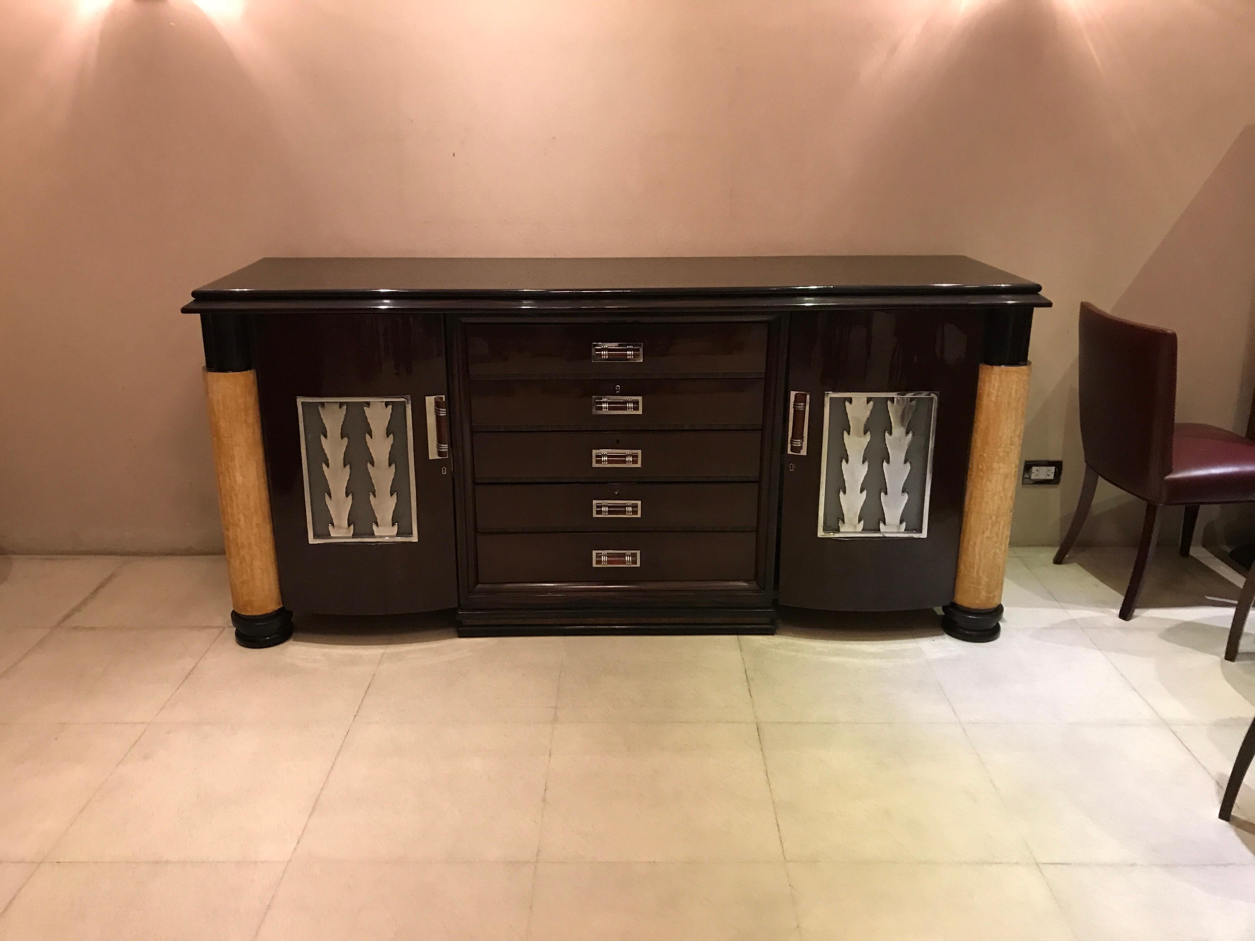 Luxury Sideboard with drawers 

Materials: wood , parchment, Bronze chromed, glass
Style: Art Deco French
If you want to live in the golden years, this is the cupboard that your project needs.
We have specialized in the sale of Art Deco and Art