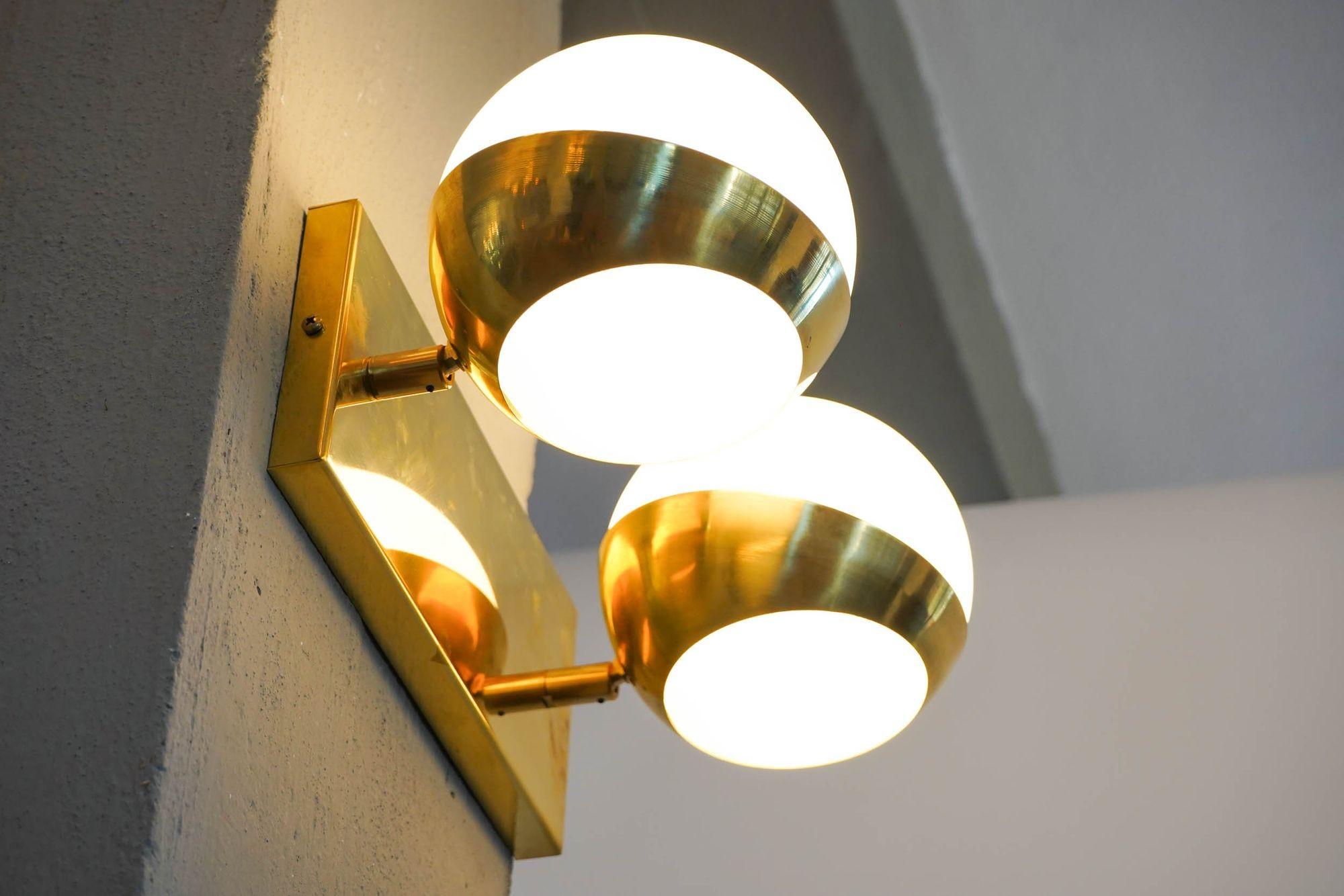 Italian Siderale Twin Shades Brass and Lattimo glass Sconce, Silvio Piattelli Design For Sale