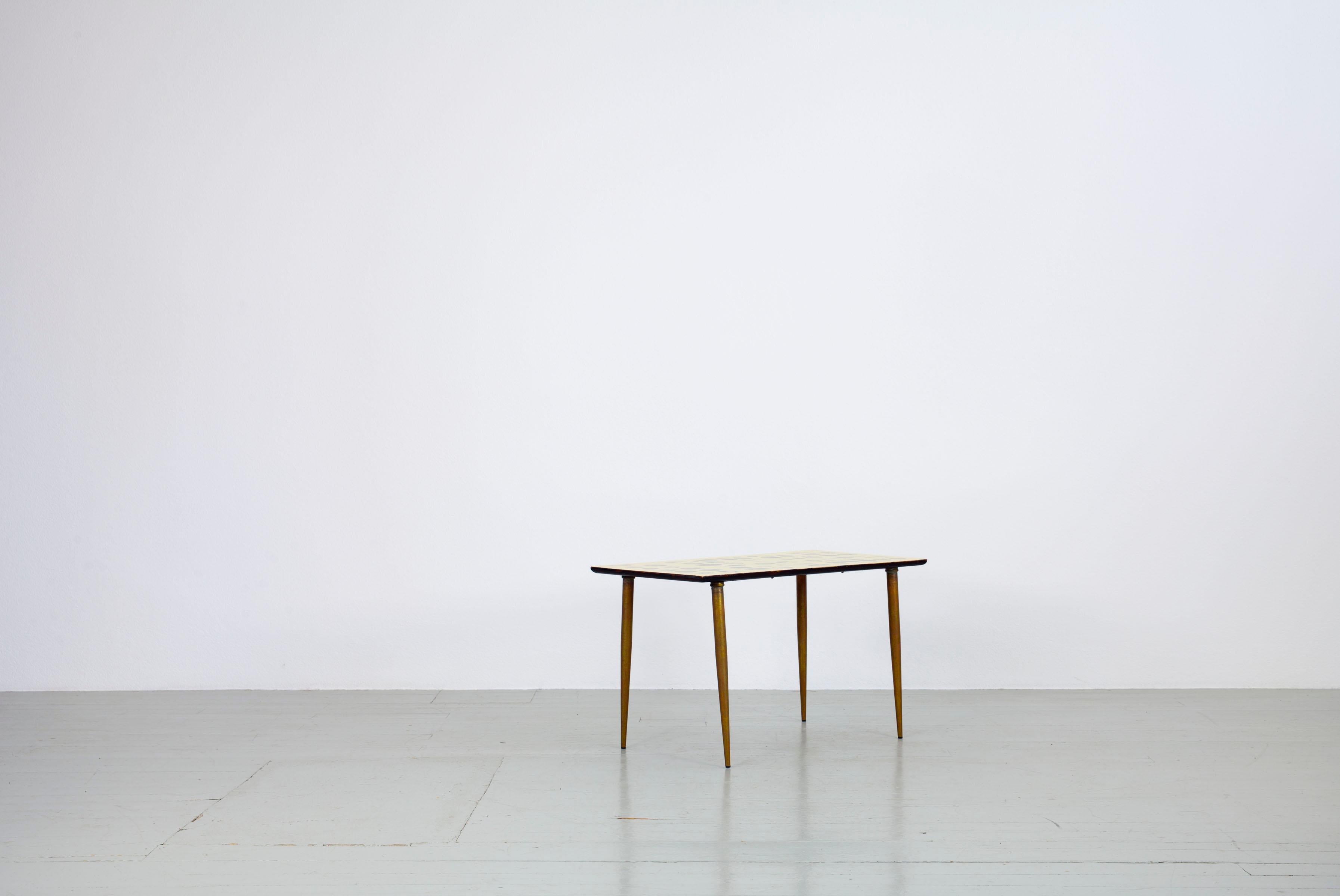 Vitage Side Table with Shell Motive and brass legs, Italy, 1950s. In the manner of Piero Fornasetti.
