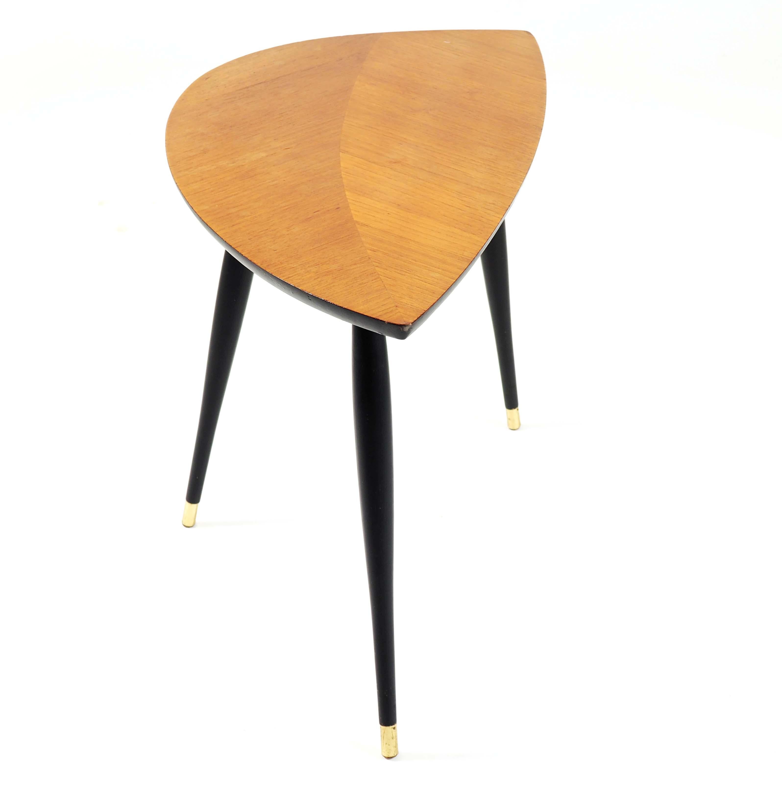 This table was one of the first designs sold by Ikea in a flat package. Who could then know what that would lead to? It is made with mirror-laid teak finer and black painted legs.