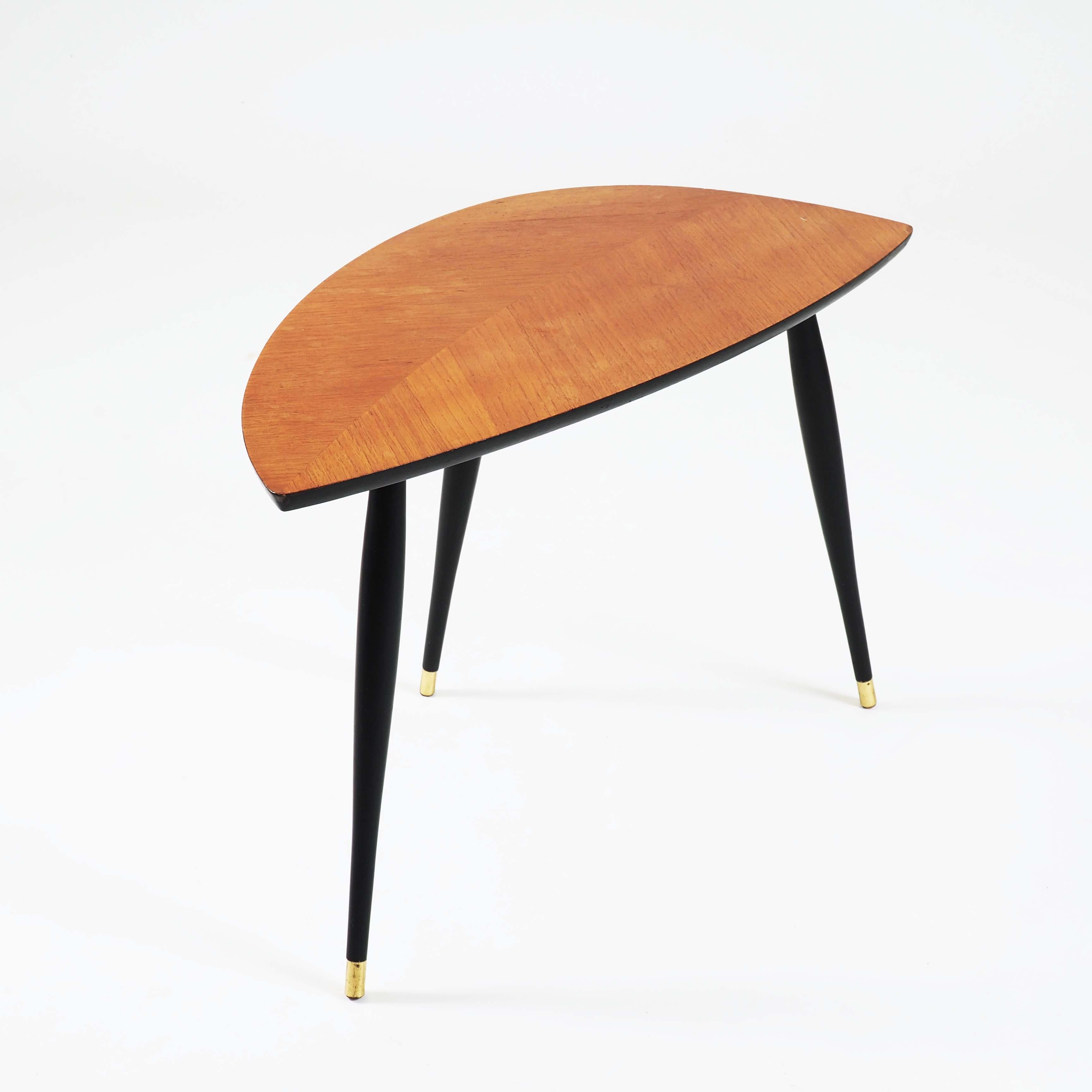 This table was one of the first designs sold by Ikea in a flat package. Who could then know what that would lead to? It is made with mirror-laid teak finer and black painted legs.