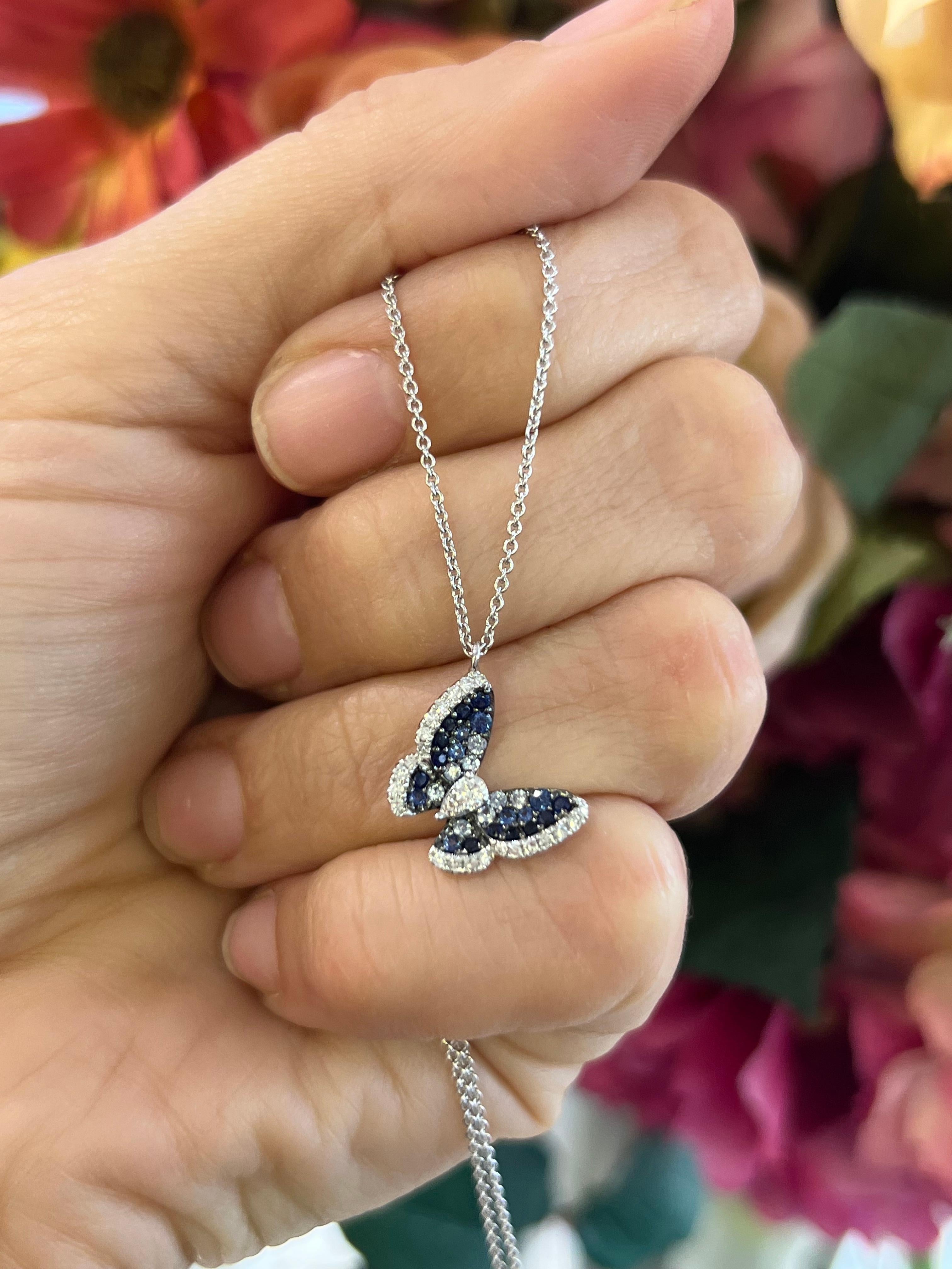 14K white gold sapphire and diamond butterfly pendant necklace.

This elegant pendant necklace features a unique butterfly shape and a stunning ombre effect of sapphires ranging from dark to lighter blue. Crafted with genuine sapphires, this