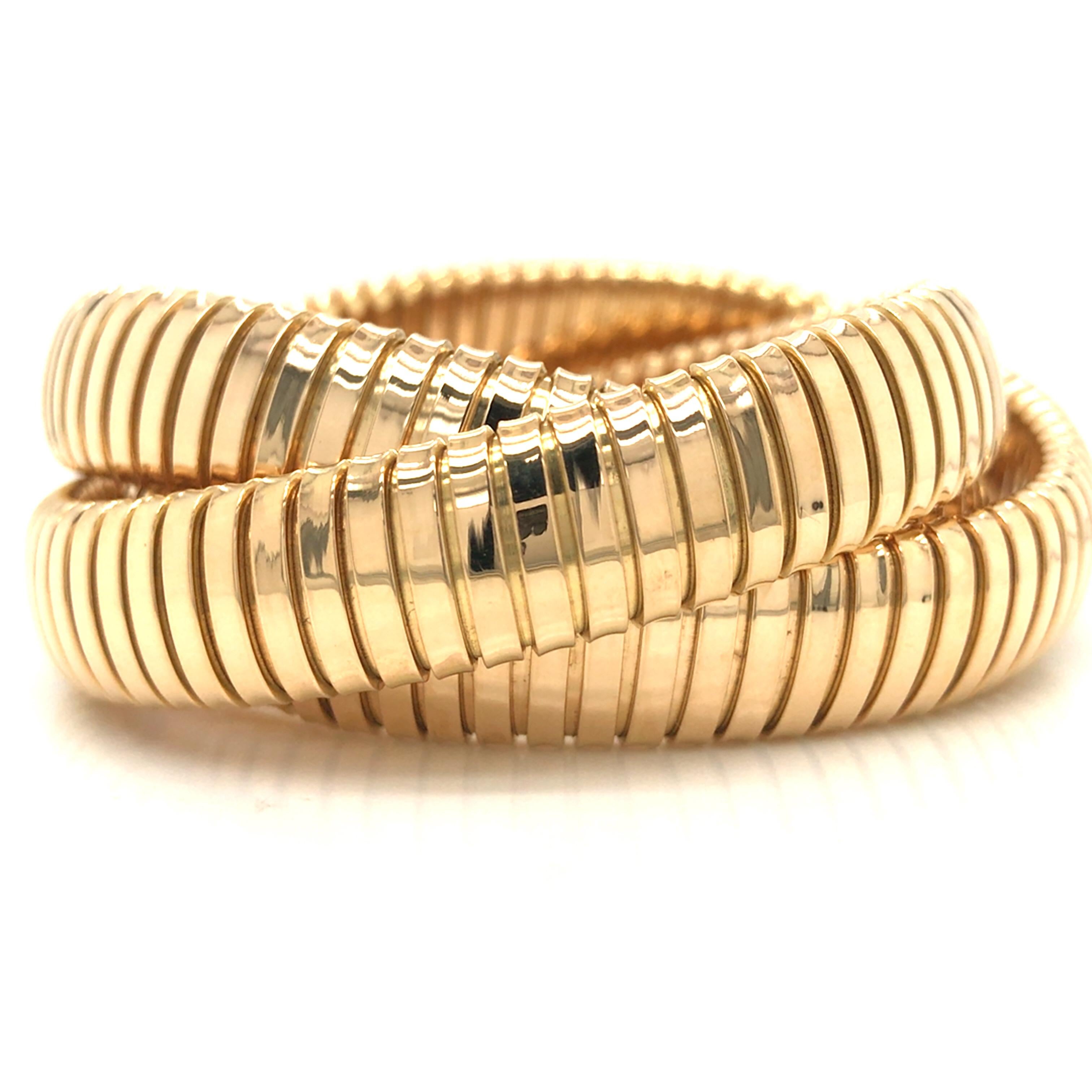 Sidney Garber Rolling Interlinked Bracelet in 18K Yellow Gold.  The Bracelet measures 6 inch inner circumference and each bangle measures 1/2 inch in width.  86.15 grams.  Stamped 750 Sidney Garber.
