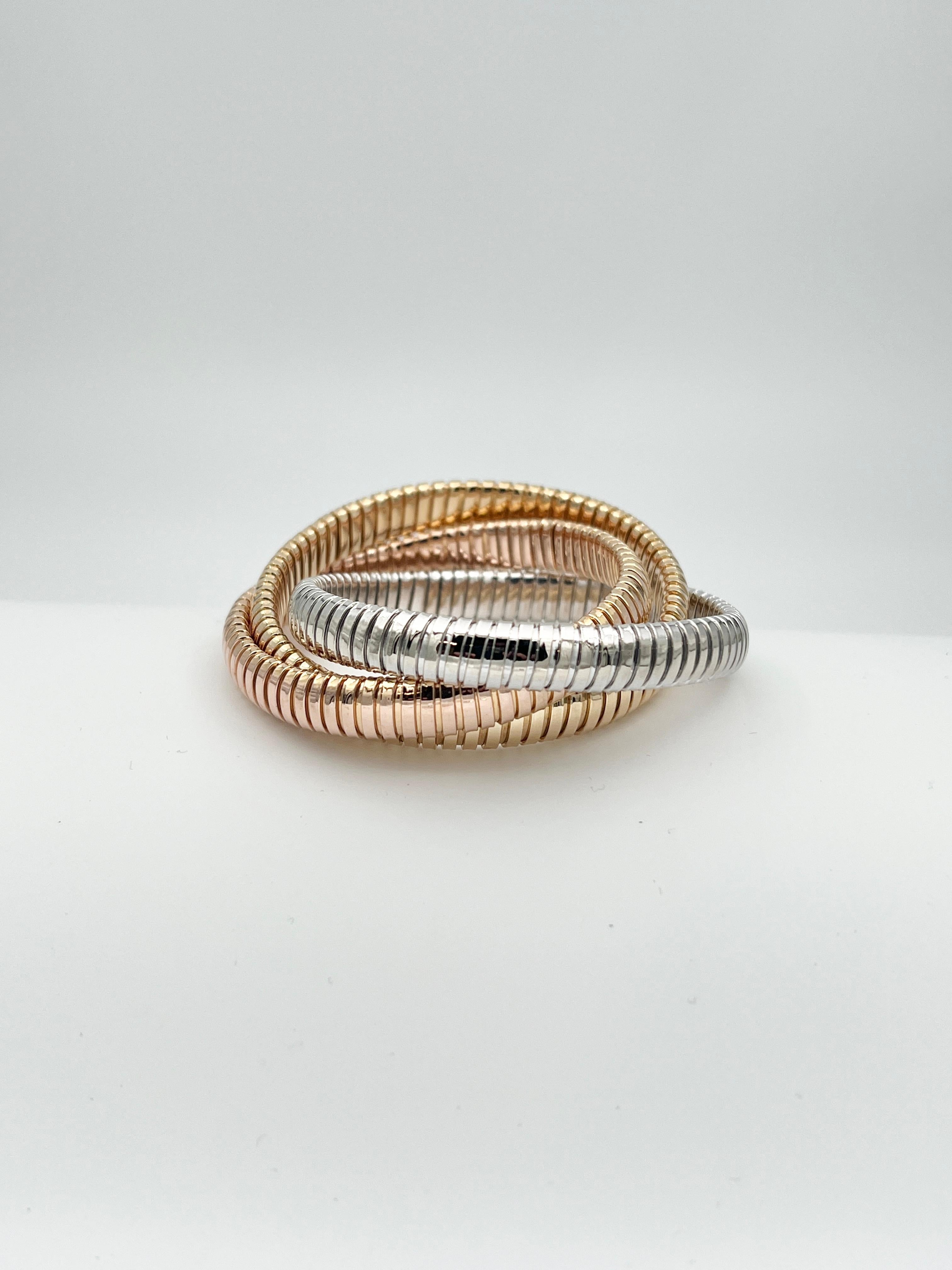 The Sidney Garber rolling gold bracelet is an exquisite piece of jewelry that exudes elegance and sophistication. Crafted from high-quality 18-karat gold, this bracelet features a unique rolling design that adds a touch of movement and texture to