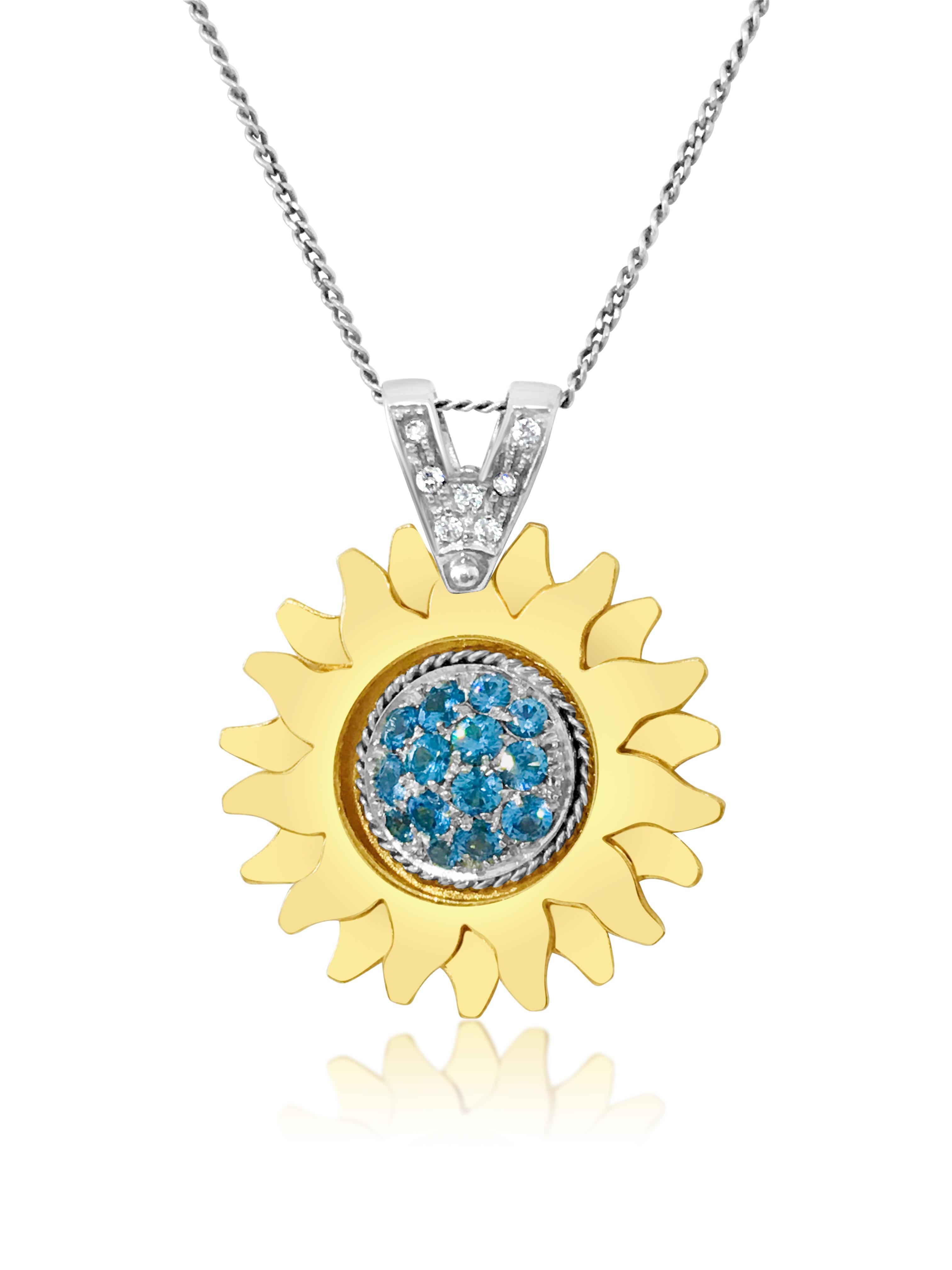 Metal: 18K yellow gold and white gold (two tone). 
1.50 carat blue topaz. 0.14 carat diamonds, VS clarity and G color. 
Total carat weight of all gemstones: 1.64 carats. Double stack sun design metal with gorgeous blue topaz set perfectly on it.