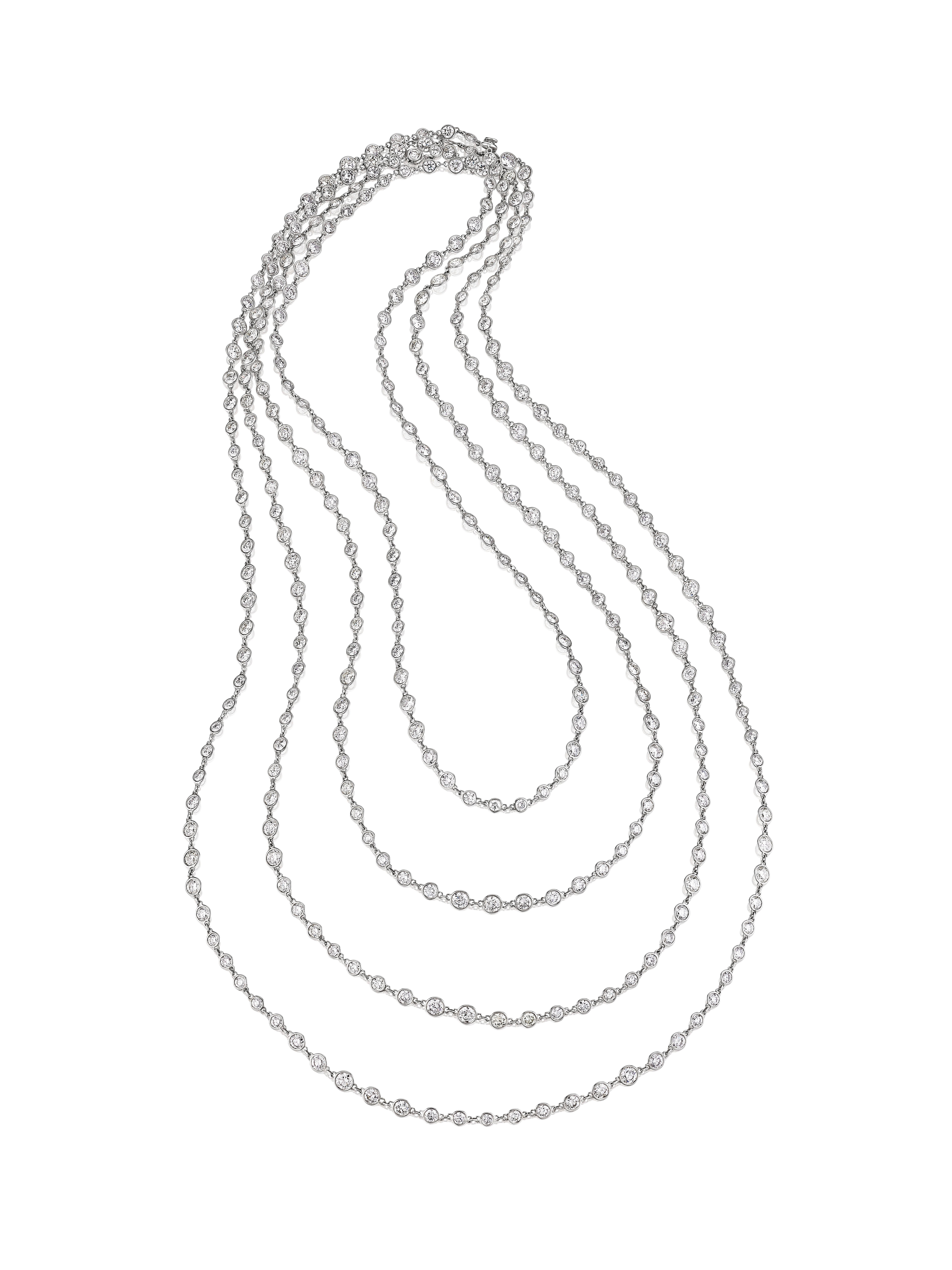 Platinum Diamond Chain Necklace by Siegelson, New York

• A necklace of classic design in the Art Deco style, a flexible long chain composed of collet-set circular-cut diamonds connected by circular platinum links; mounted in platinum
• Circular-cut