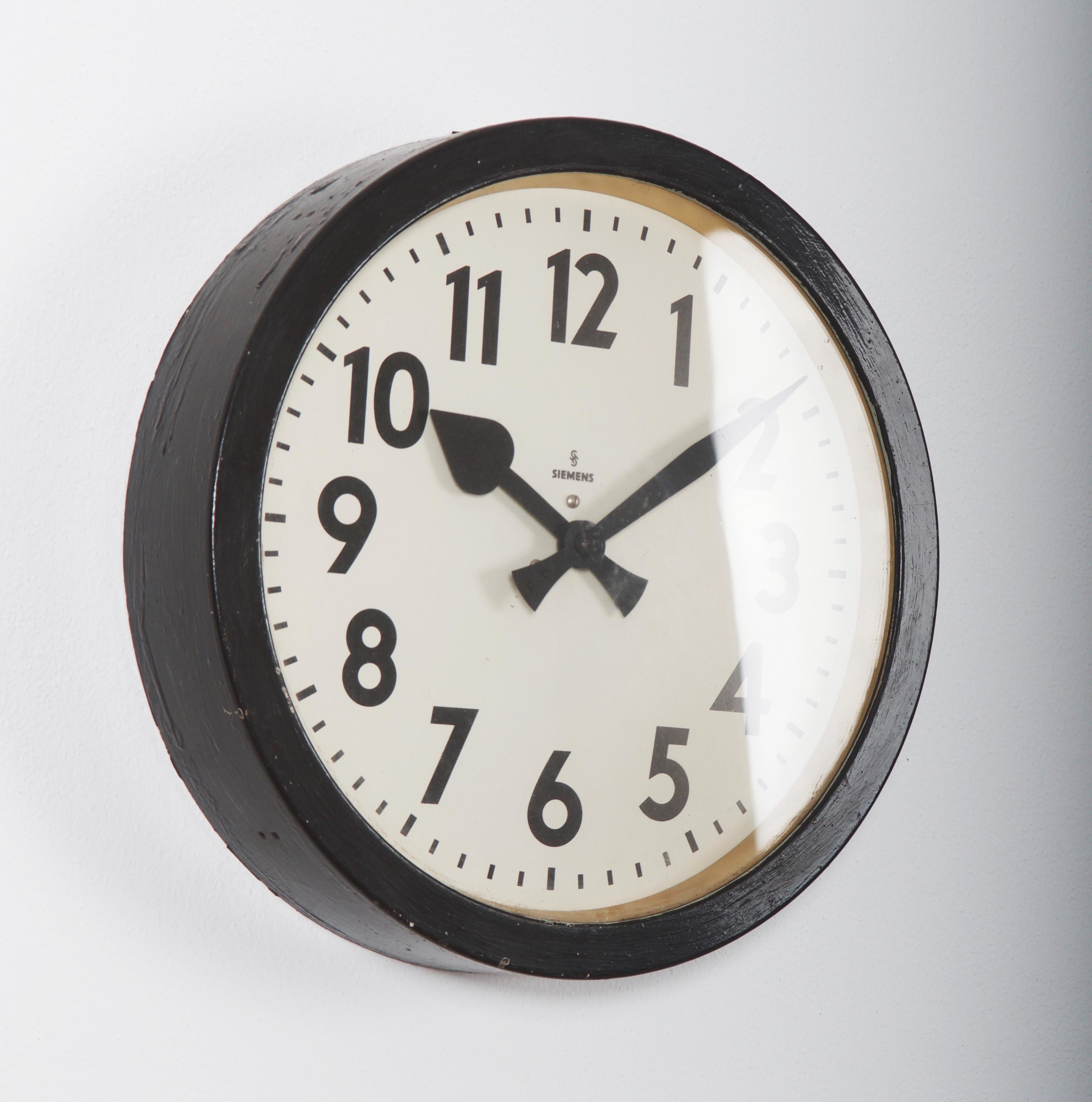 Steel painted with glass front made in Germany in the 1950s.
Formerly a slave clock, it is now fitted with a modern quartz movement with a battery.