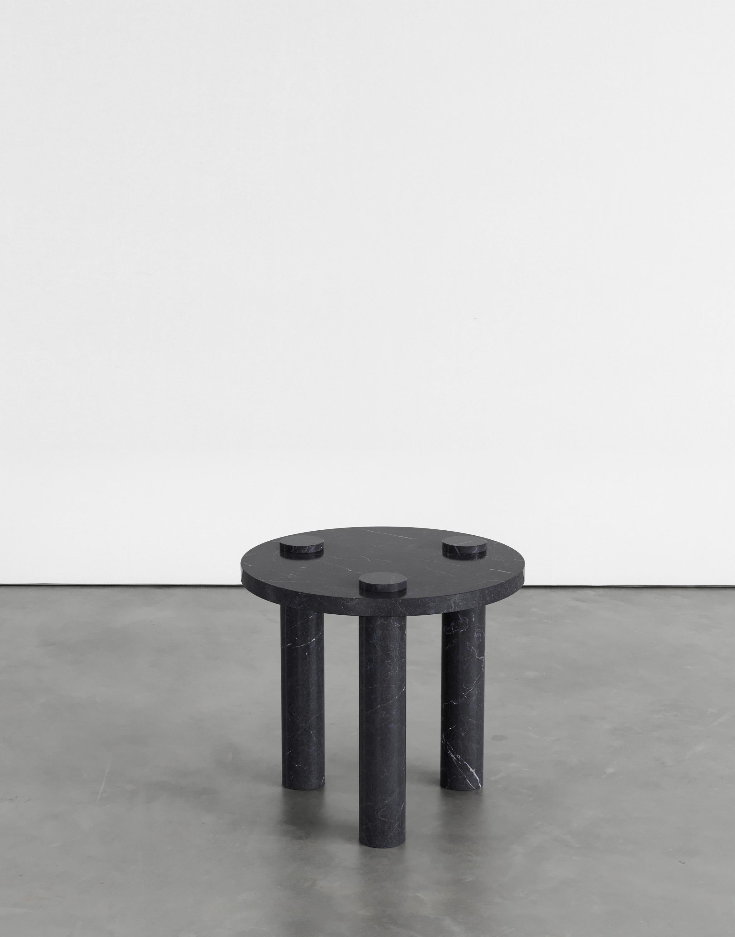 Sienna 50 Side Table by Agglomerati.
Dimensions: W 50 x H 45 cm. 
Materials: Black Marquina. Available in other stones. 

Agglomerati is a London-based studio creating distinctive stone furniture. Established in 2019 by Australian designer Sam