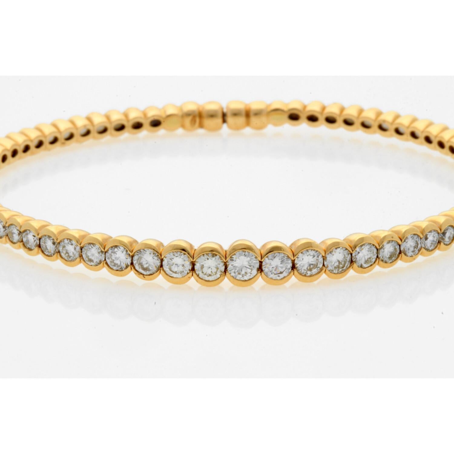 This bangle was designed by Siera and is made from 18 karat rose gold, flexible steel, and 2.30 carats of G-H color, VS clarity, round brilliant diamonds. The diamonds are bezel set into beads along the first half of the bracelet. The bangle