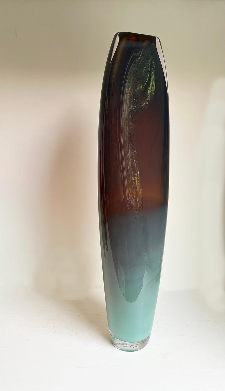 'Sierra Refractions' available as a single vessel or a group of four. 
An edition of only 4 unique vessels ranging from heights of 56-60cm.

These long limbed glass vessels are inspired by the tonality and luminosity of colour found in the layers of
