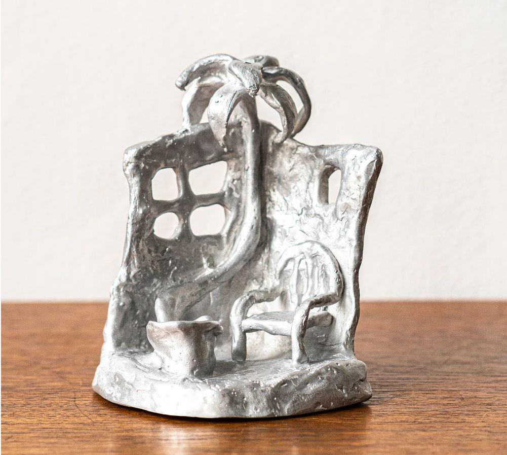 Cast Handmade Aluminium cast sculptural candle holder depicting 'Siesta' For Sale
