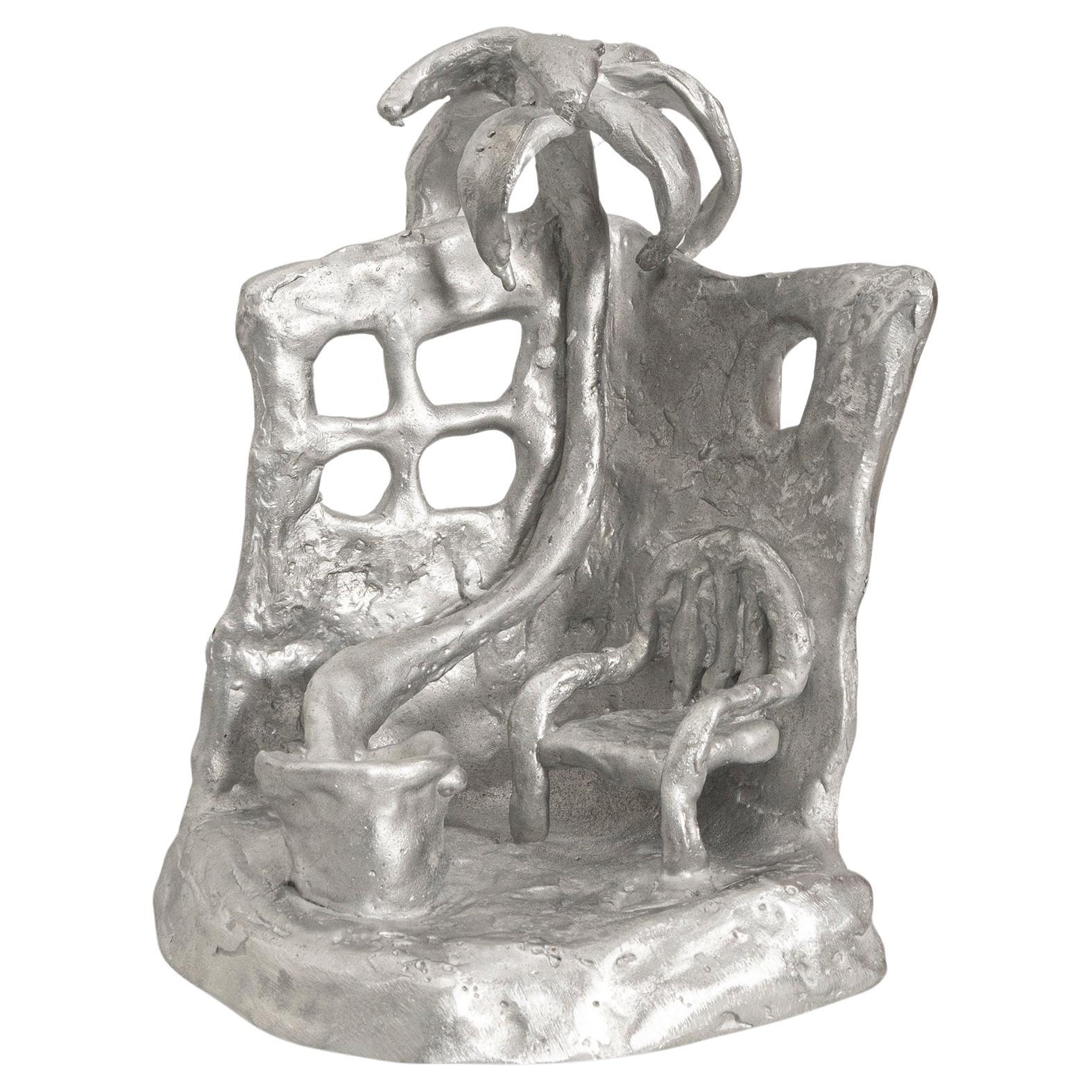 Handmade Aluminium cast sculptural candle holder depicting 'Siesta' For Sale