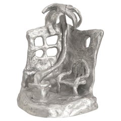 Handmade Aluminium cast sculptural candle holder depicting 'Siesta'