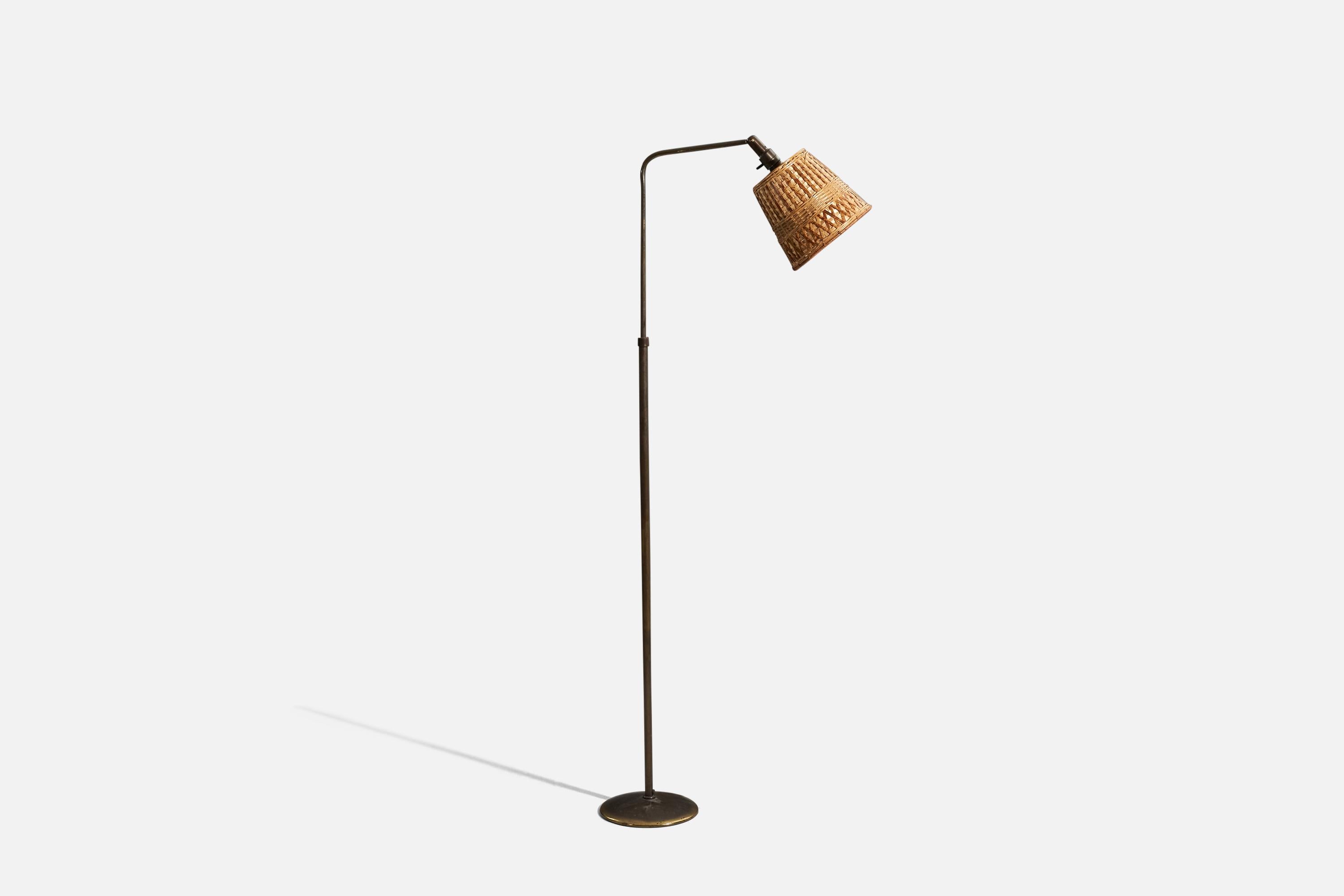 A bronze and rattan floor lamp designed by Sigfried Giedion & Hin Bredendieck
and produced by B.A.G Turgi Bronzewarenfabrik, Switzerland, 1930s. 

