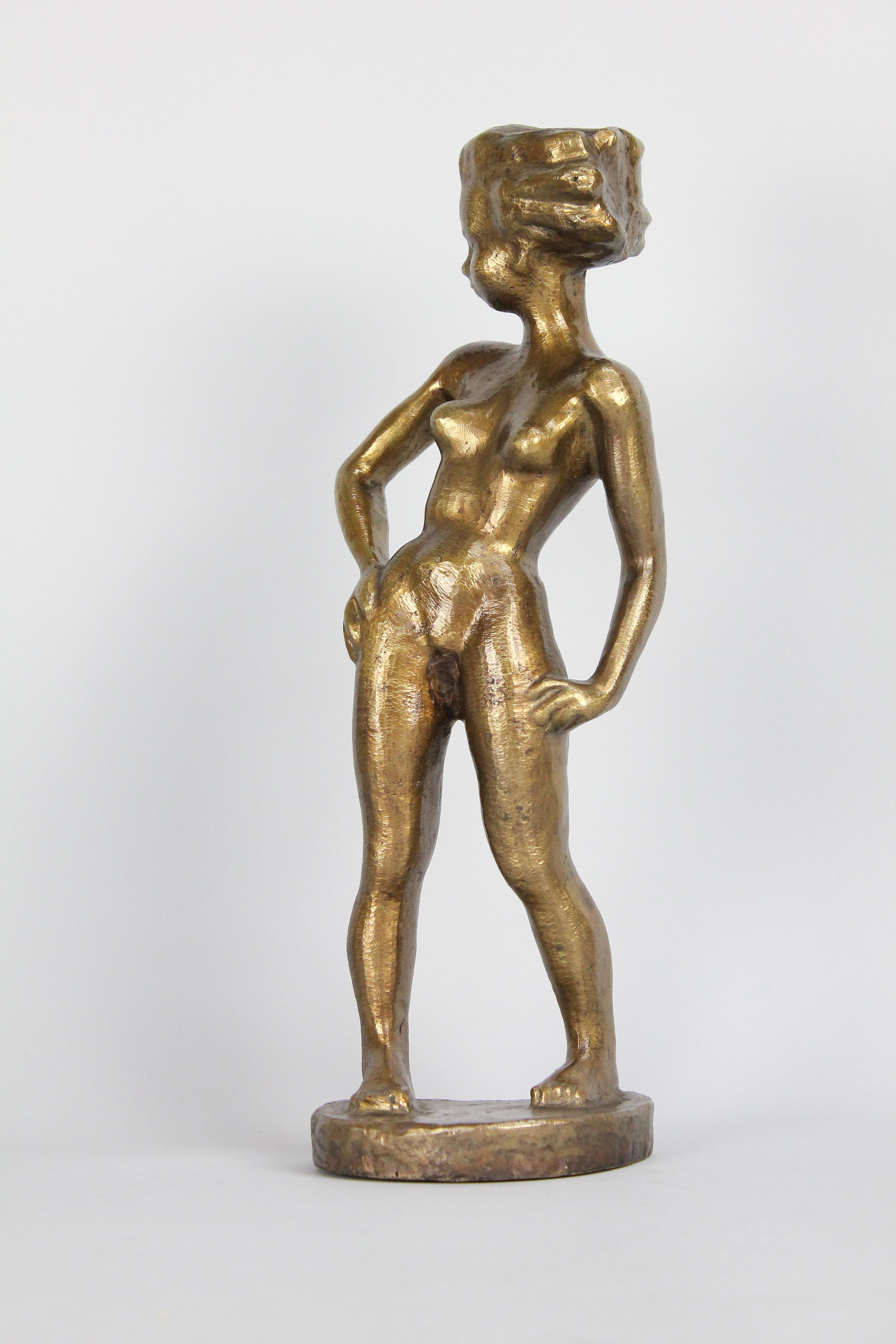 A young woman with an attitude! That pose says it all!

Cast in golden bronze and signed 