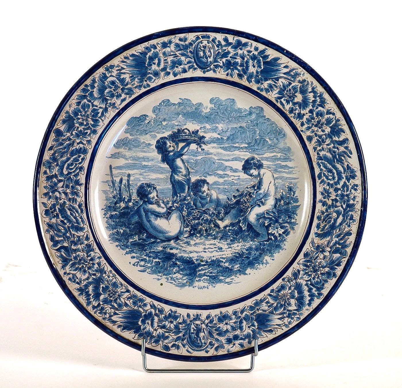 A magnificent and rare Nevers faience plate, hand-painted in a blue cameo, depicting Putti.
Our plate signed on the backside in green, A Montagnon factory, late 19th century.

Beautiful French work, late-17-19th century by the earthenware Nevers