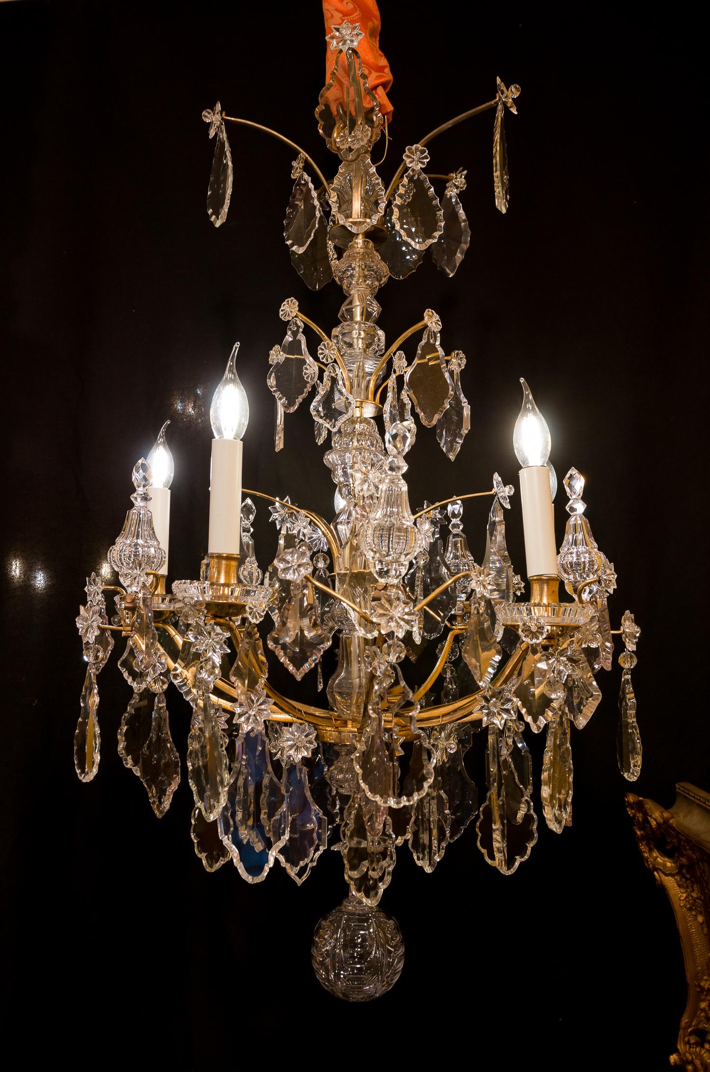 Sign by Cristalleries de Baccarat gilt bronze and cut crystal chandelier, circa 1880

A beautiful original gilt-bronze and cut crystal chandelier in the classic French 18th-century style. 
Our chandelier is composed of five perimeter arm-lights.
