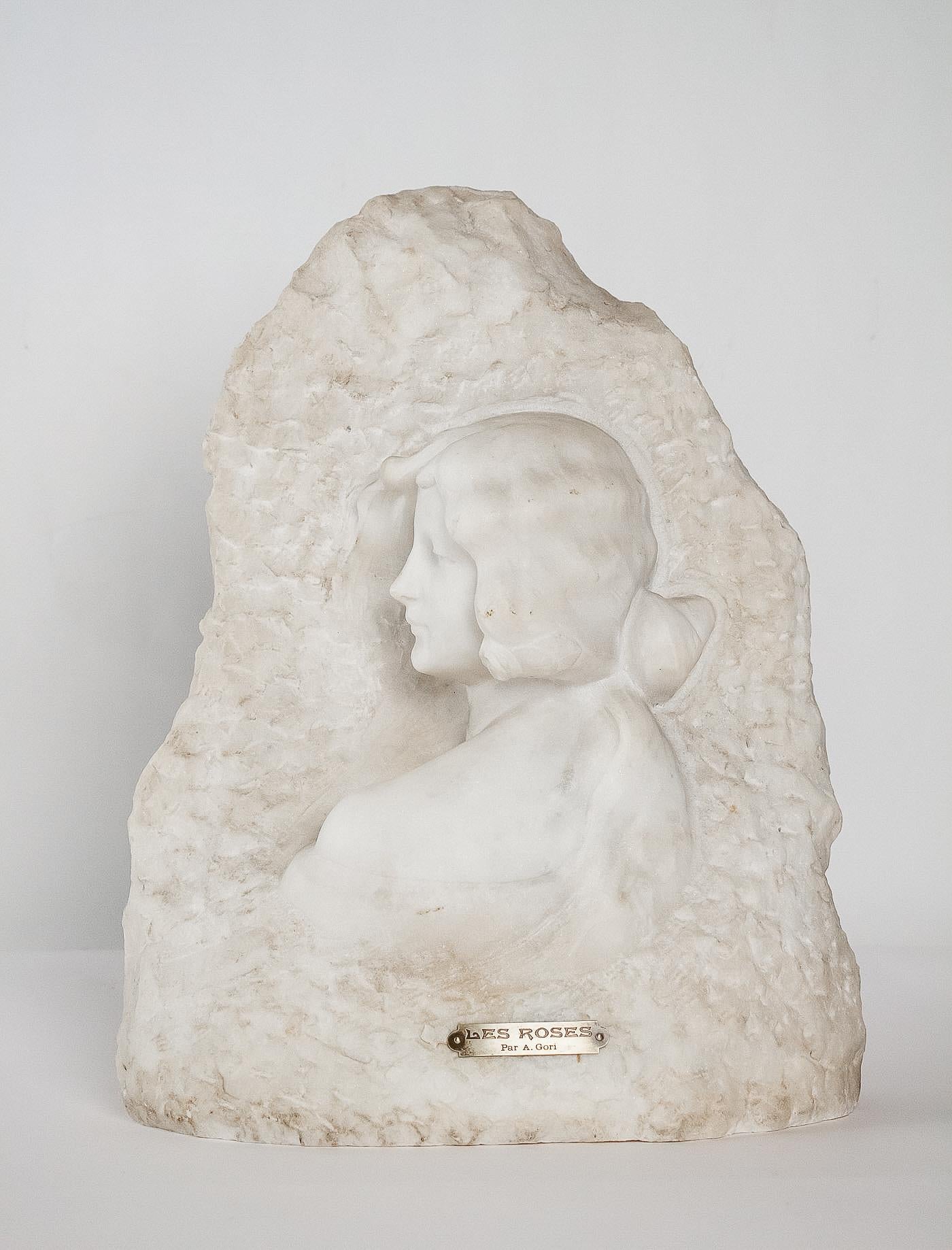 A magnificent and rare white Carrara marble sculpture representing an attractive profile woman with rose in hair. The sculptor voluntarily decided to let the observer think that we model surrounded with a bush of suggested roses.
Beautiful
