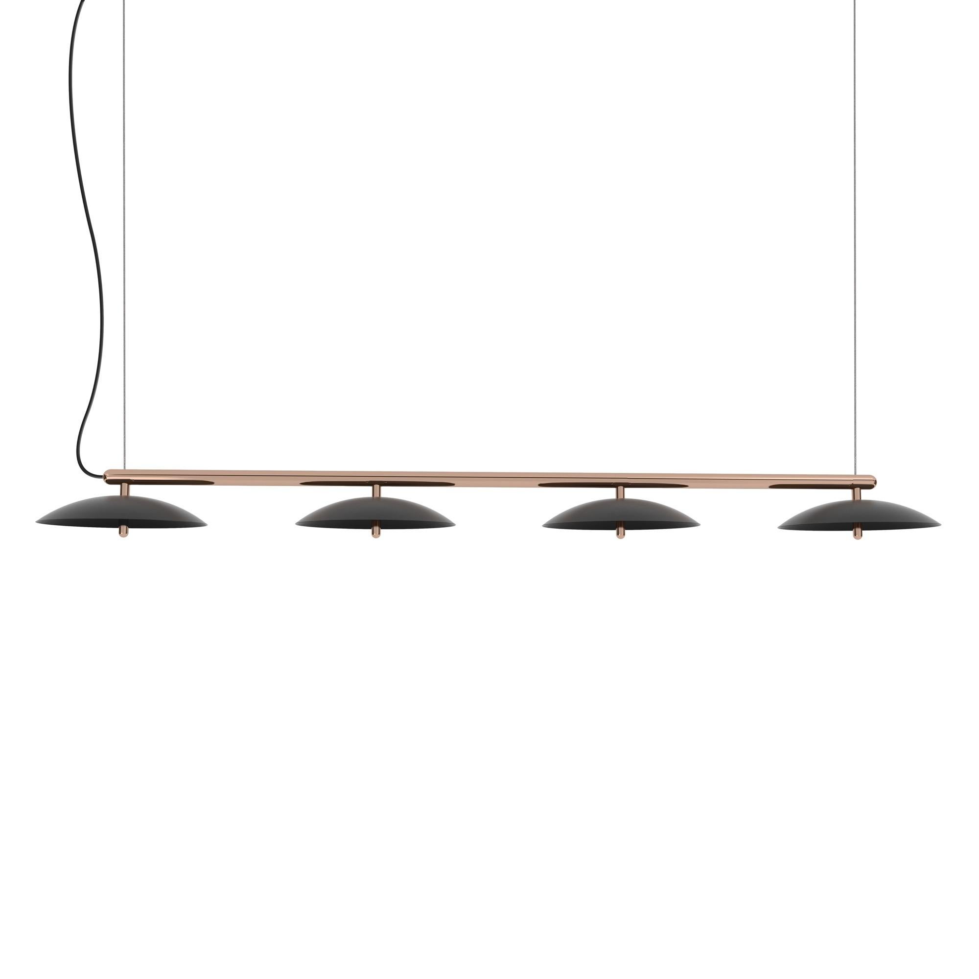 Perfect above a dining table or a conference table, the Signal Linear Pendant is a decidedly modern linear suspension light. A polished metal arm effortlessly supports spun metal shades that cast a downward glow through perforated diffusers. The