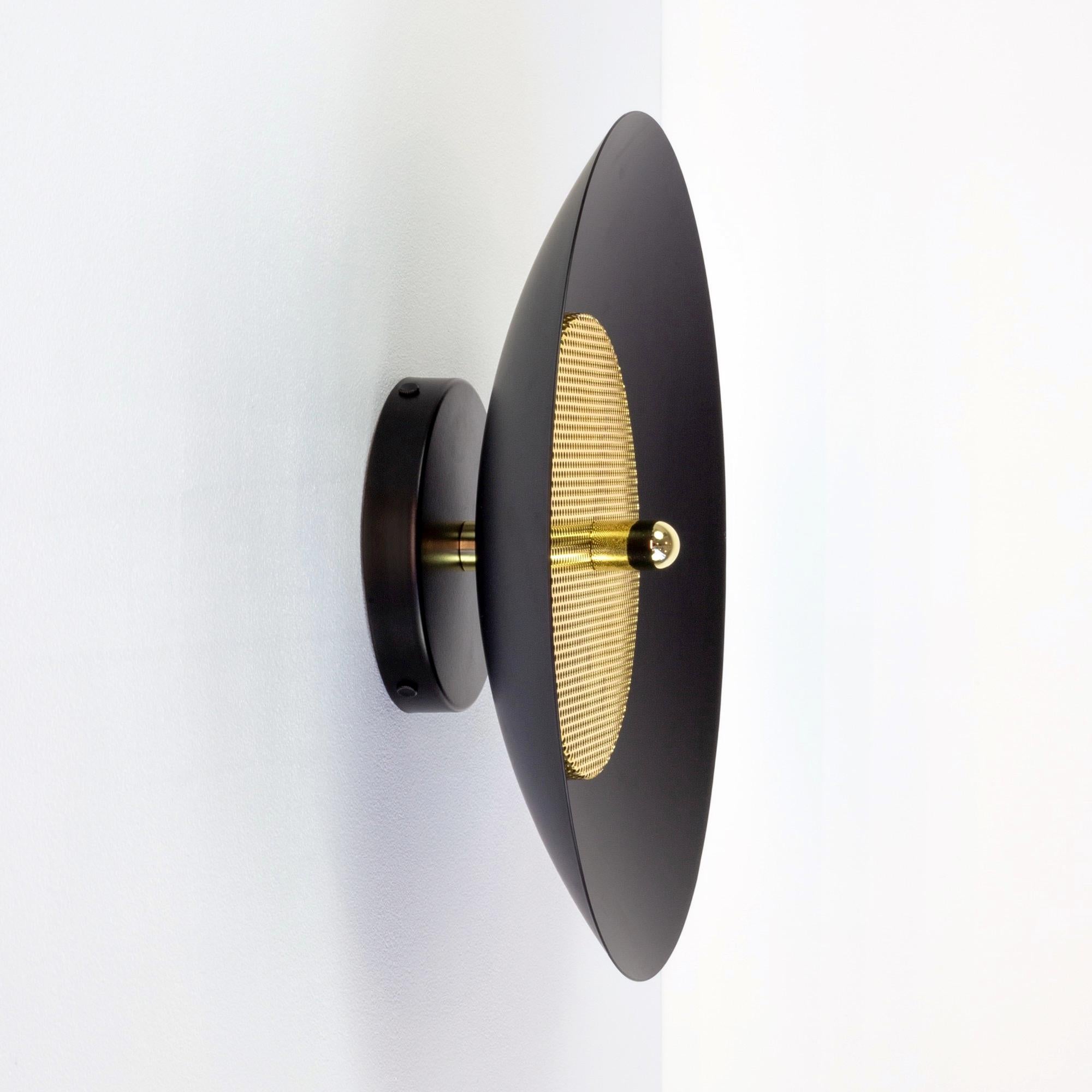 Modern Sconce or Flush Mount. Composed of a spun metal shade that reflects light filtered through a perforated metal diffuser, the subtle warmth of the signal sconce is perfectly balanced by it’s striking form. With their refined lines and numerous