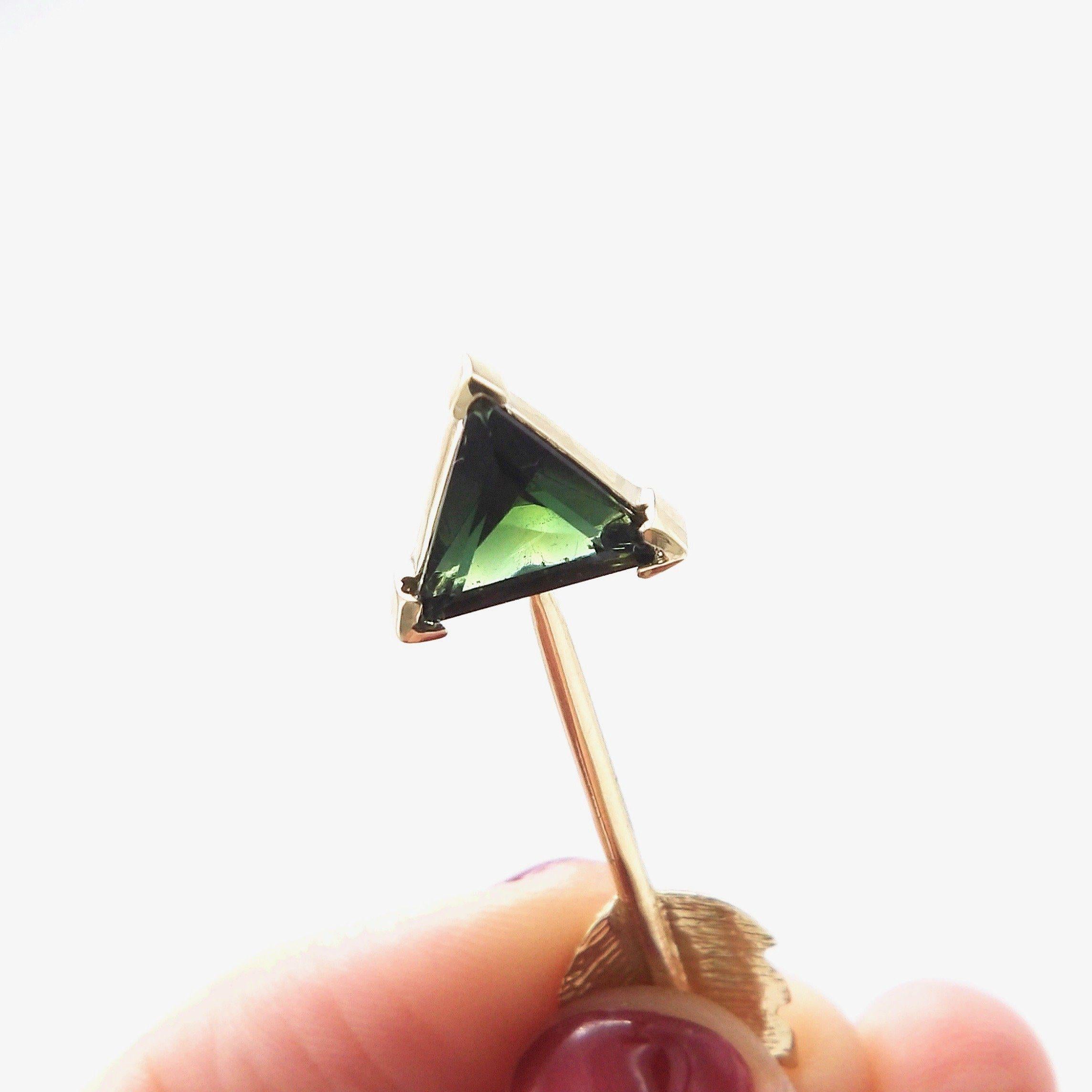 This gorgeous 14K arrow features a luminous dark green tourmaline. This signature piece was inspired by the arrows of martyrdom of Saint Sebastian. An iconic figure, he was ordered to be killed by the Roman emperor Diocletian. He was persecuted, and