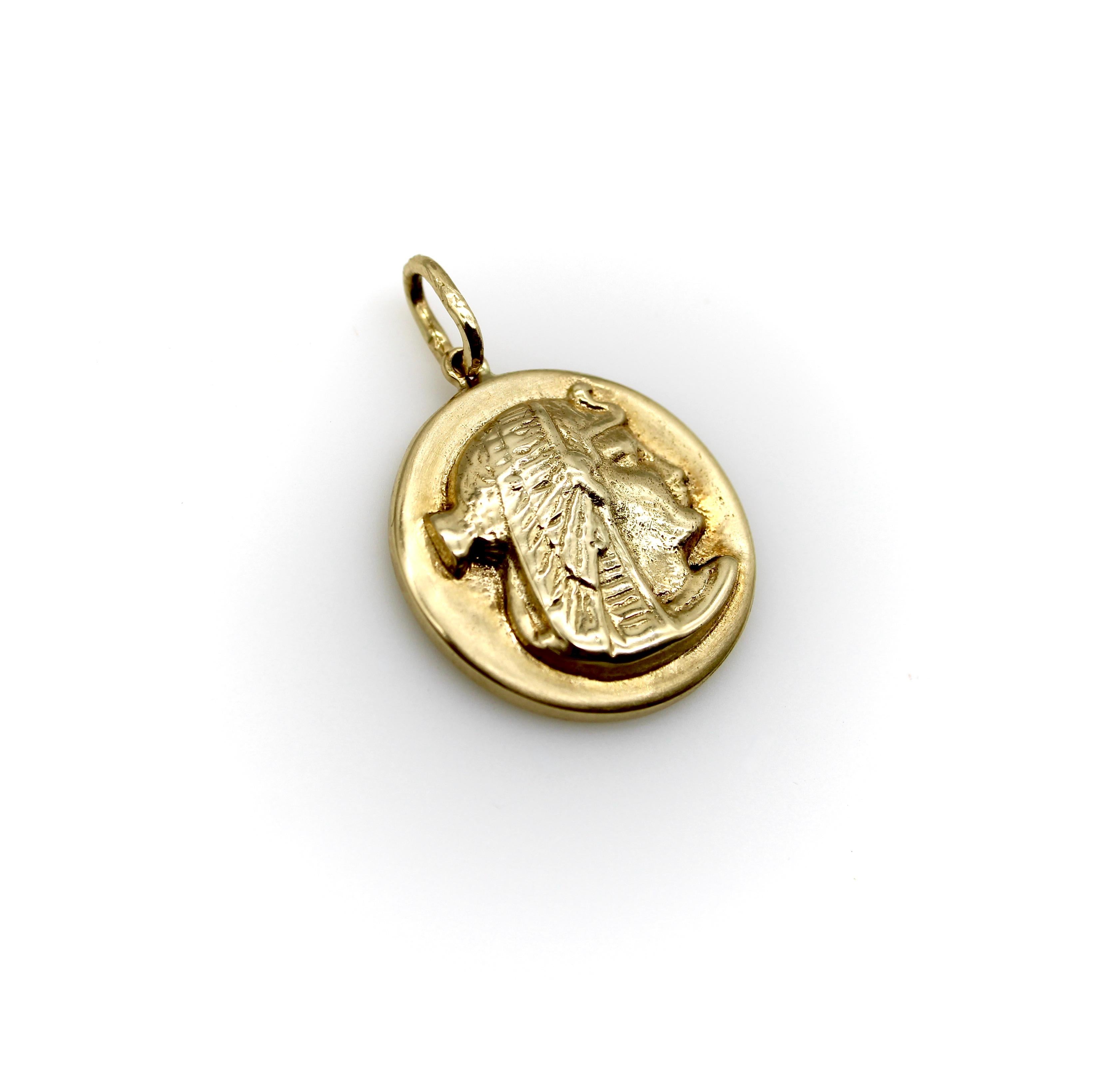 Part of Kirsten’s Corner’s Cute as a Button series, this 14k gold charm was cast from a Victorian era button. It features a side profile view of the goddess Nekhbet wearing her traditional vulture headdress. The charm is medallion-shaped with a nice