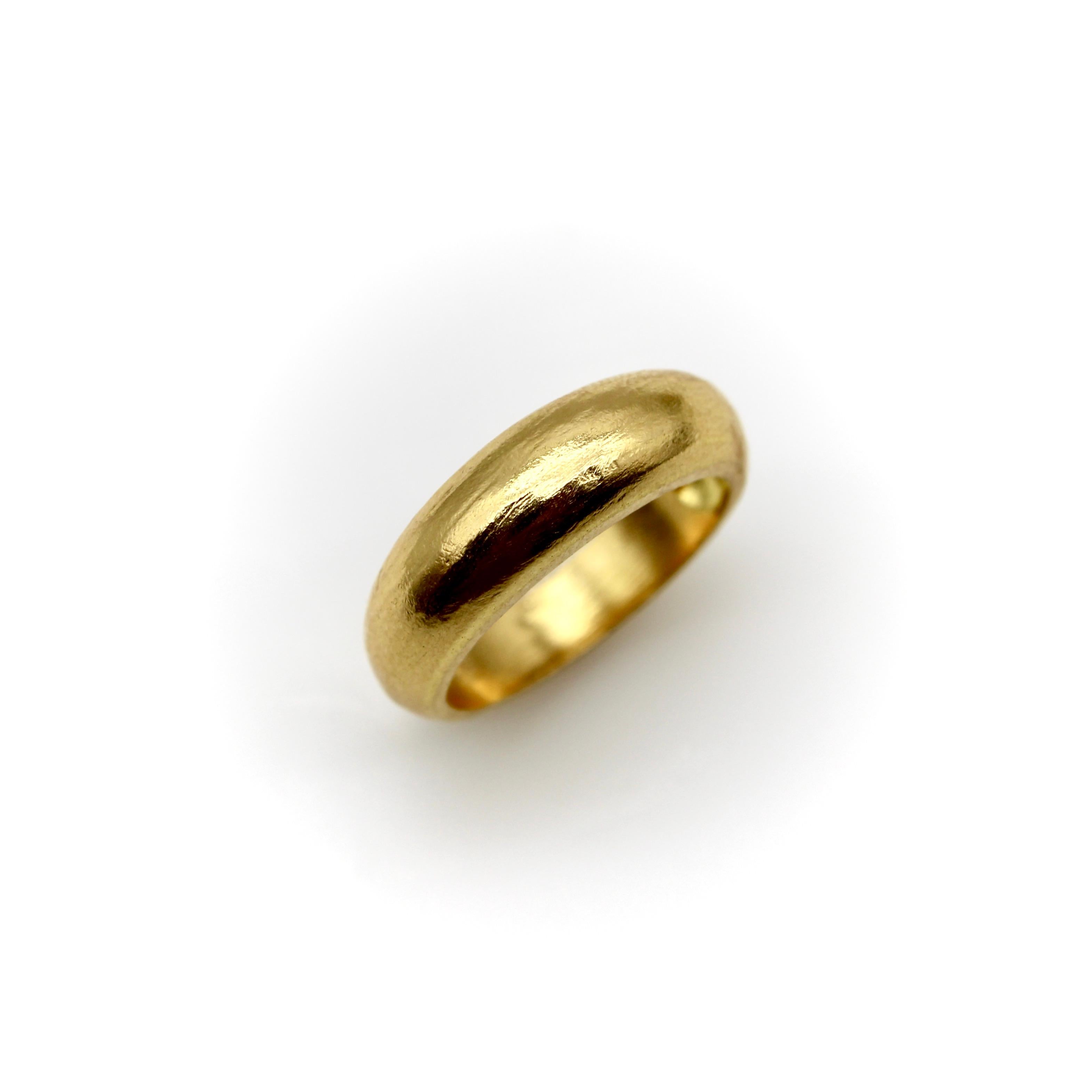 Kirsten’s Corner has a love for both high karat gold and a good, simple dome ring. This 22k gold signature piece is a classic dome ring with a slight rise to it. The ring has a nice finish that is not high polish, but also not quite matte—a