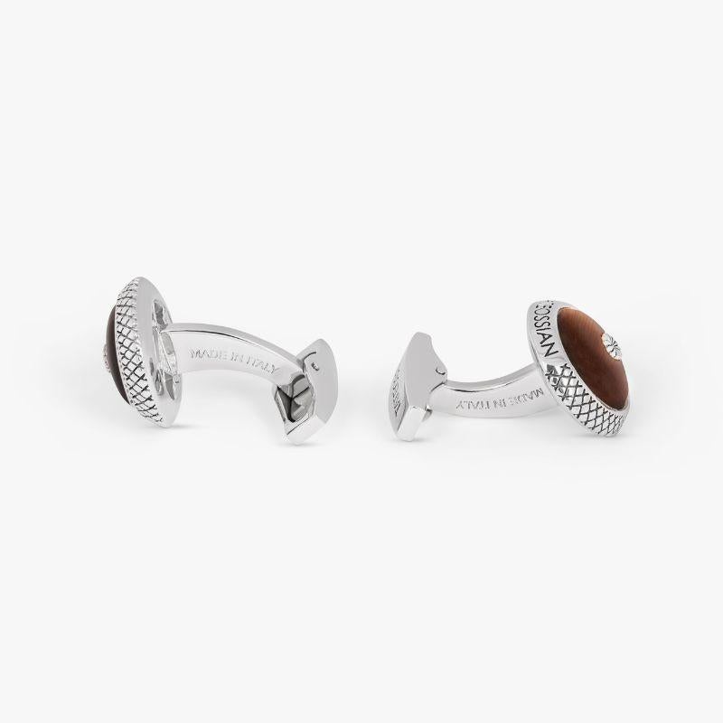 Signature Chrysanthemum Dome Cufflinks with Tiger Eye in Sterling Silver

Our Japanese inspired cufflinks feature a domed semi precious stone which is the centrepiece of this classic design. The signature round Tateossian case has the diamond