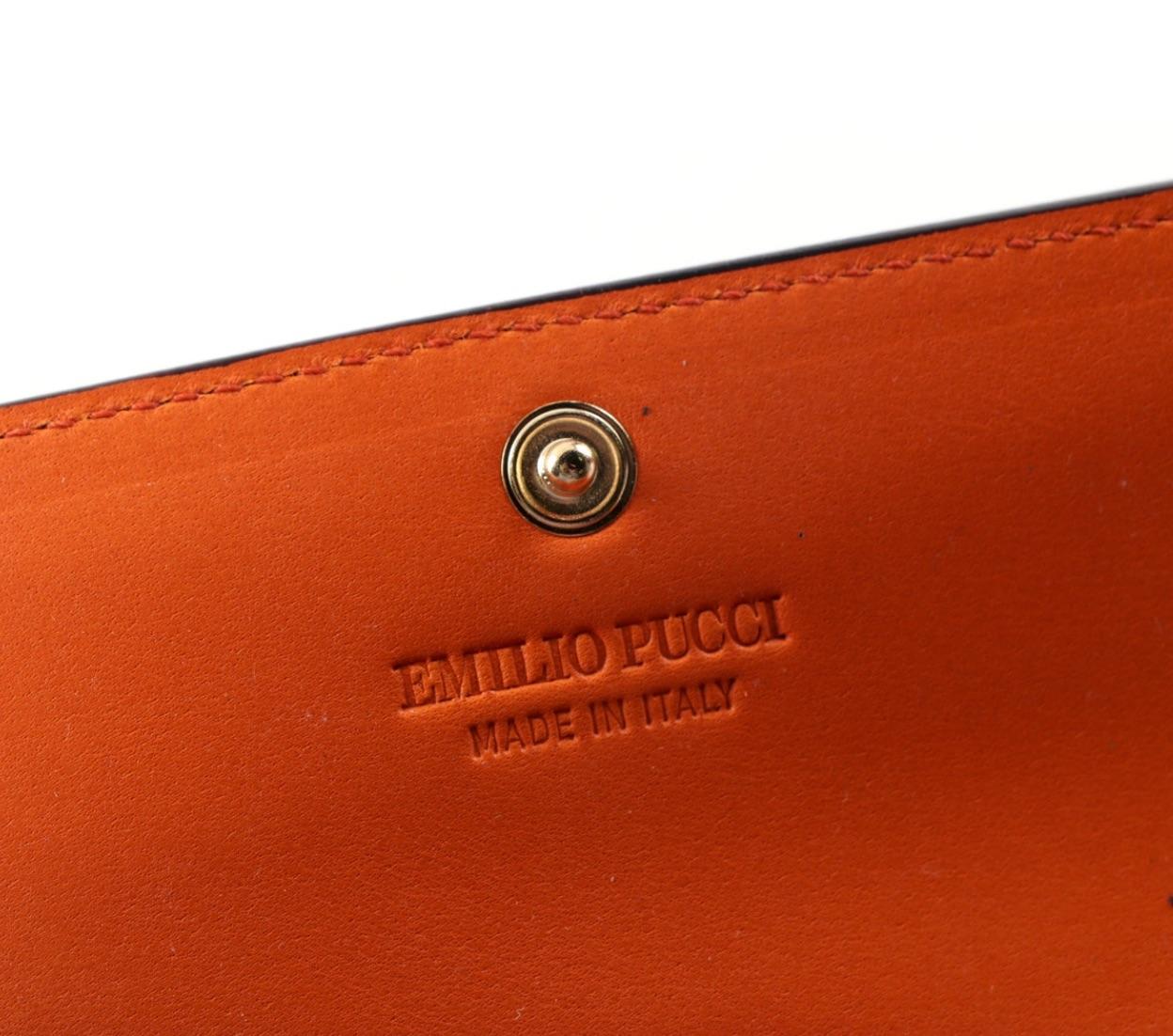 For a Fashionista by a Great Fashion Designer!
Gorgeous authentic Emilio Pucci Leather Print Wallet with a Beautiful Orange Leather Interior and Signature Pucci Fabric in the original Pucci Box with label. Portfolio Style with 2 Pockets on either