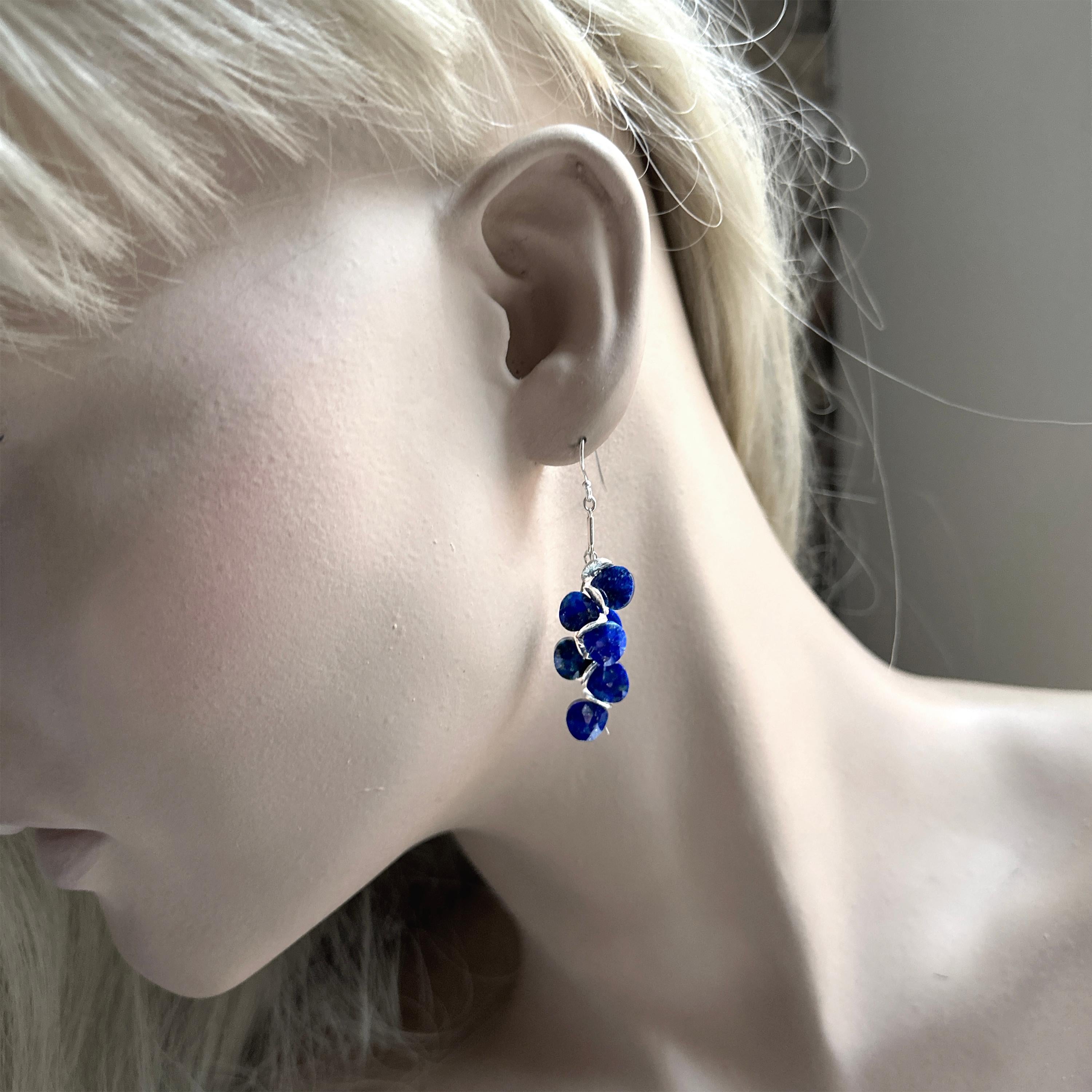 Let elegance sparkle from your ears with these exquisite Lapis Sterling Signature Earrings. Hand crafted with deep blue lapis briolette clusters, sterling silver details, and ear wires for a secure fit. Show off your unique style and make heads