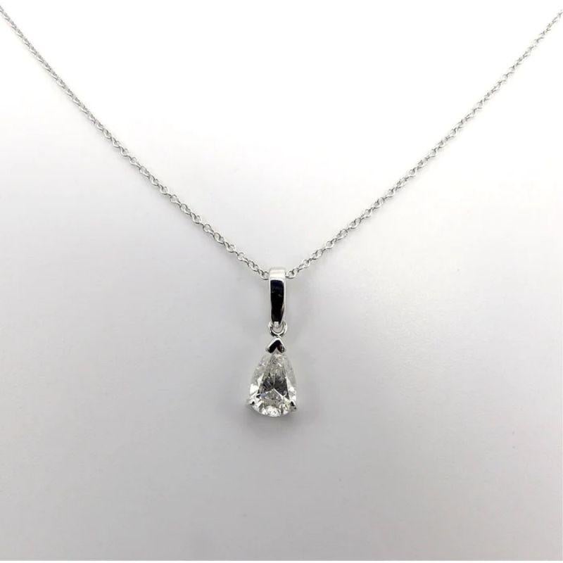 This is an elegant, signature necklace featuring a bright, pear-shaped diamond pendant that’s great for casual or evening attire. This gorgeous pear-shaped diamond has been custom set in an 18k white gold three prong mount. It’s attached to a