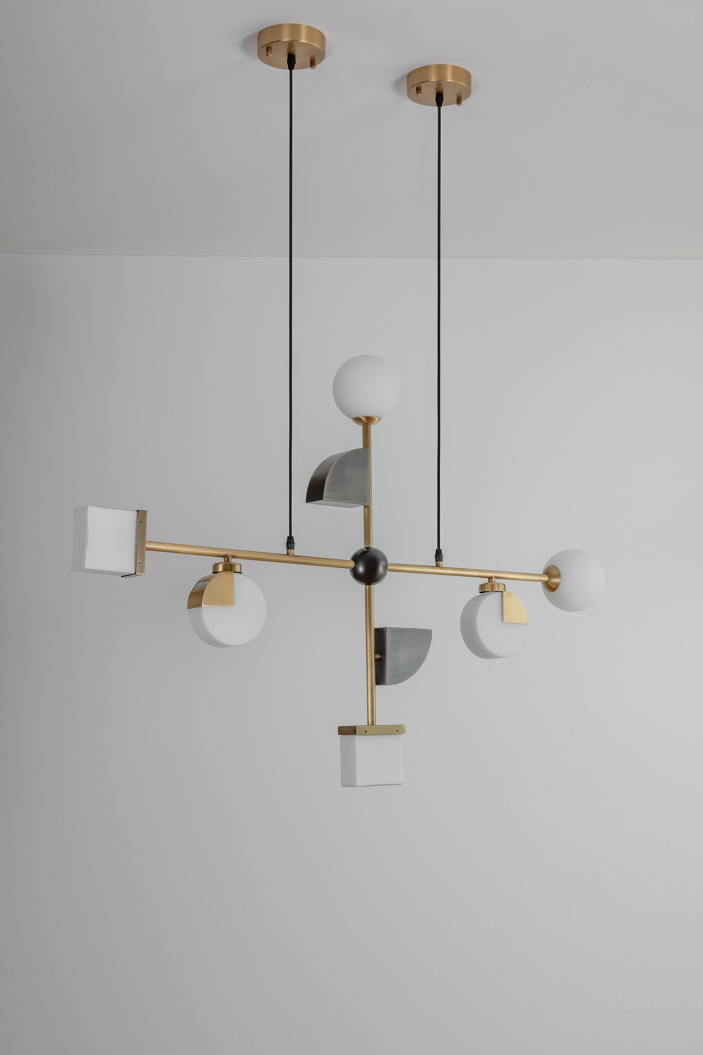 Signature Pendant Light by Square in Circle
Dimensions: D 108 x W 10 x H 76 cm
Materials: Brushed brass/ white frosted glass/ brushed grey metal/ black fabric flex
Other finishes available.

This pendant light is designed taking inspiration from our