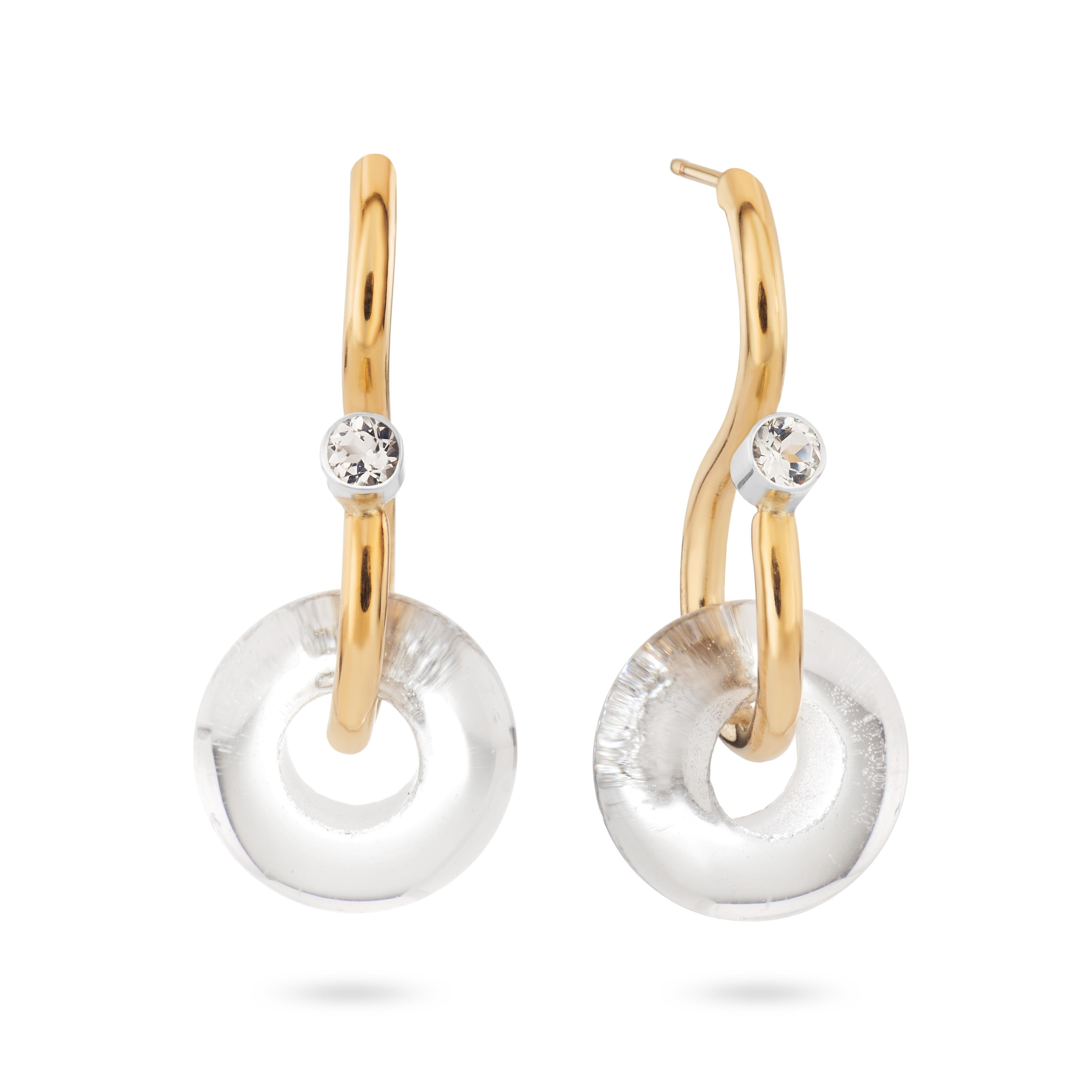 A modern style, the poise earring creates the illusion of depth through the curvature and formation of the wire. Inspired by the S shaped chain link created for the poise necklace, the signature poise earrings featuring crystal quartz and white