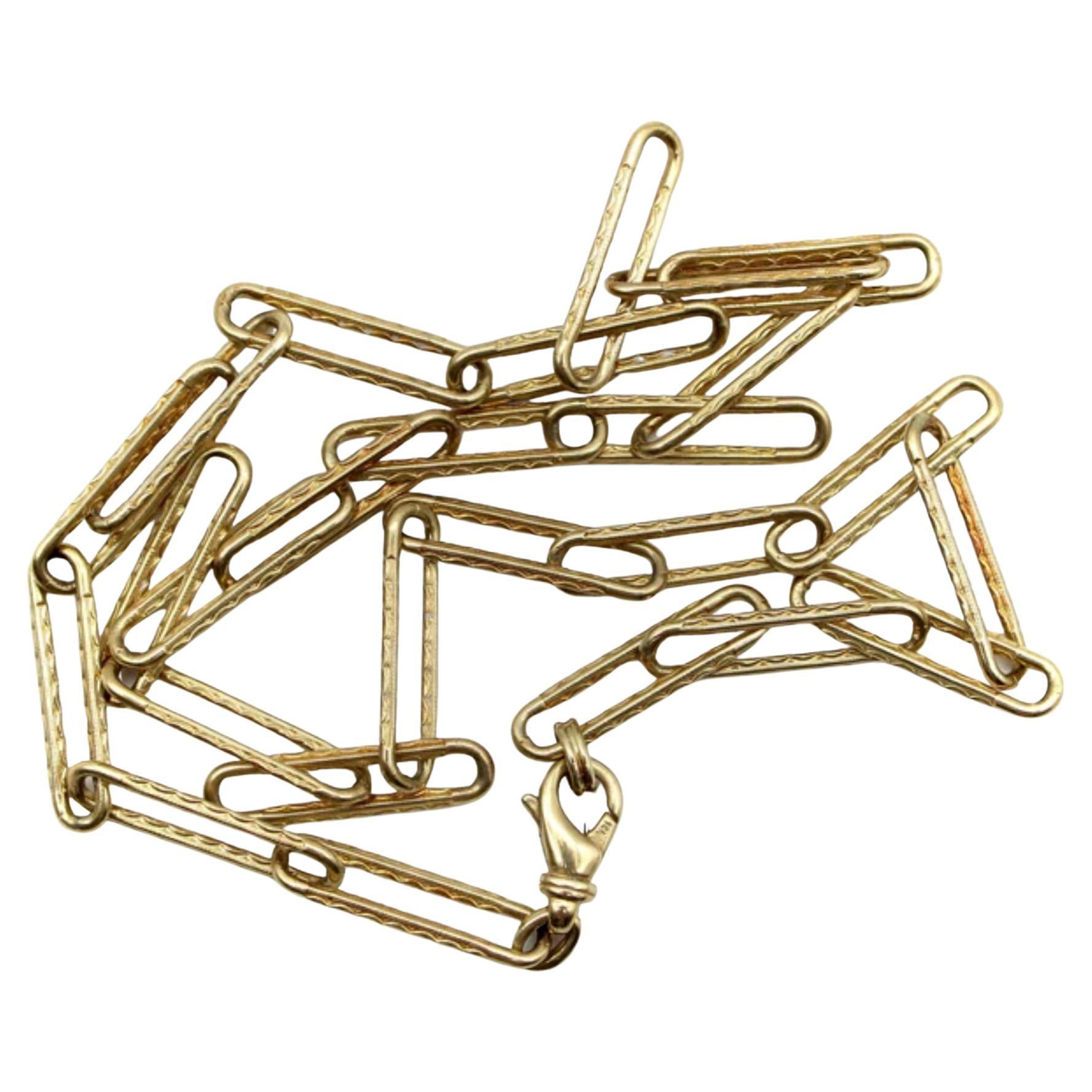 When we came across a fabulous Victorian era watch chain in silver, we fell in love with its textured paper clip links and knew we needed to make a version of the necklace in gold. We made molds from the original links, and then created a 14k gold